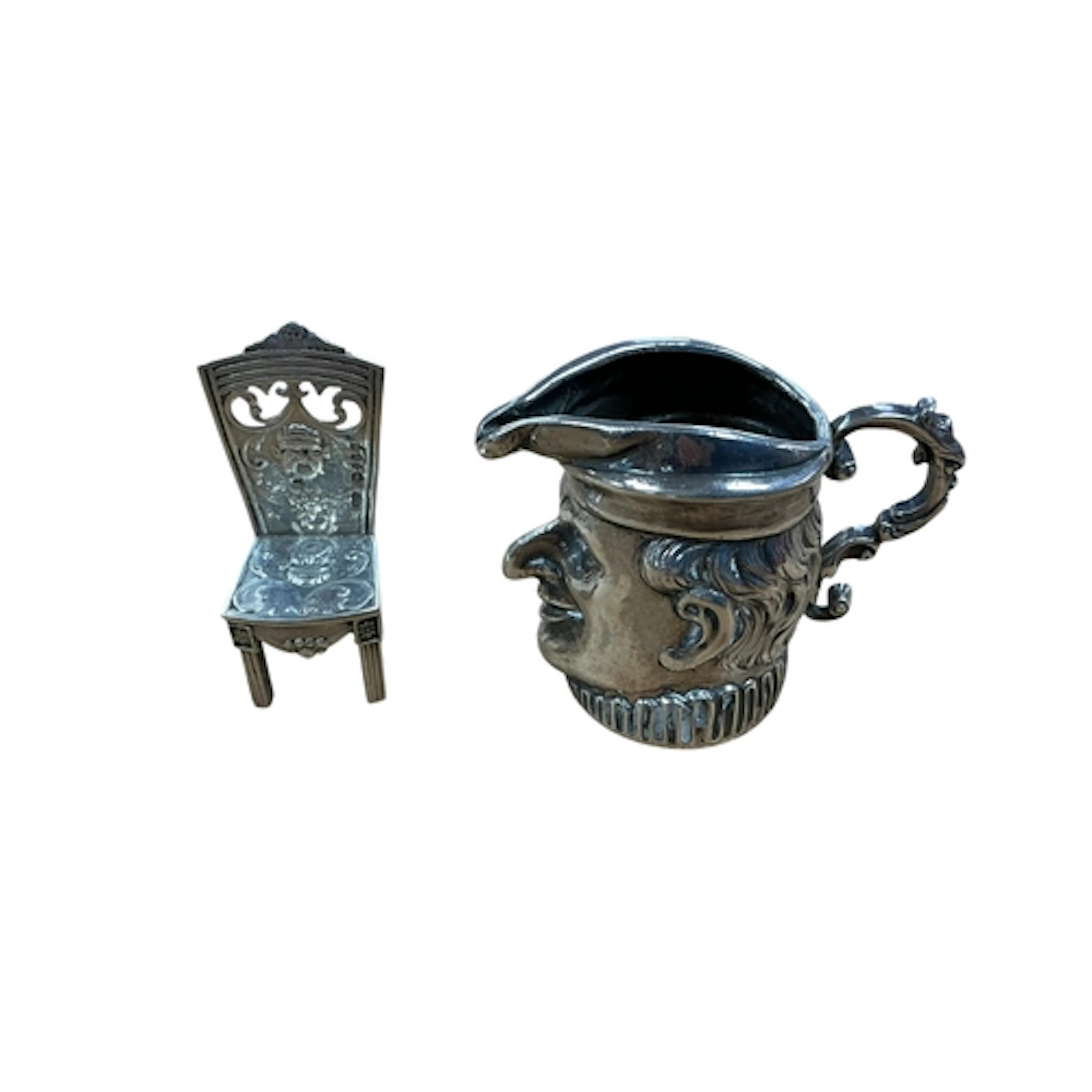 An early 20th century Hanau small silver novelty cream jug, ...