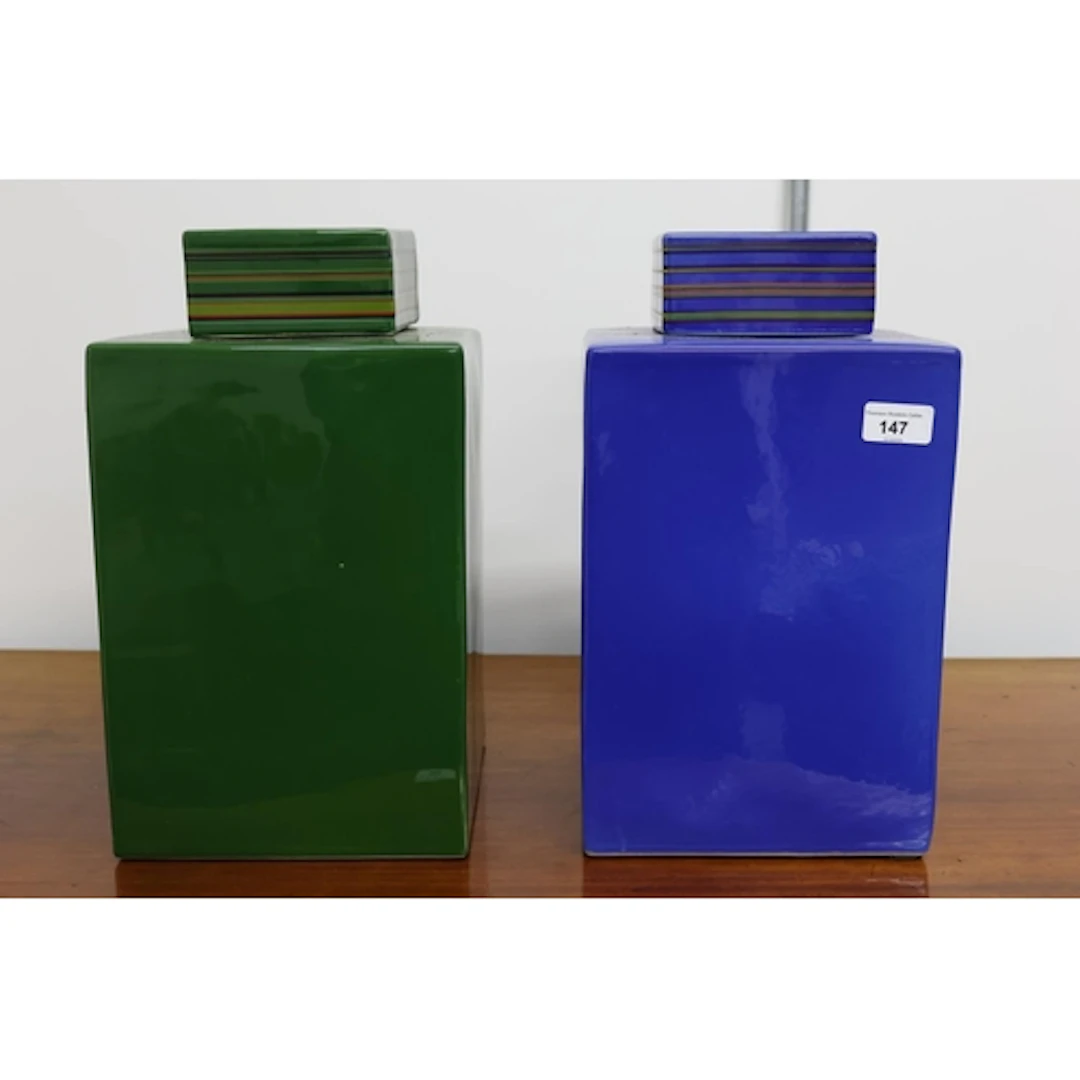 Matched pair of jars and covers, one in green, one in blue, ...