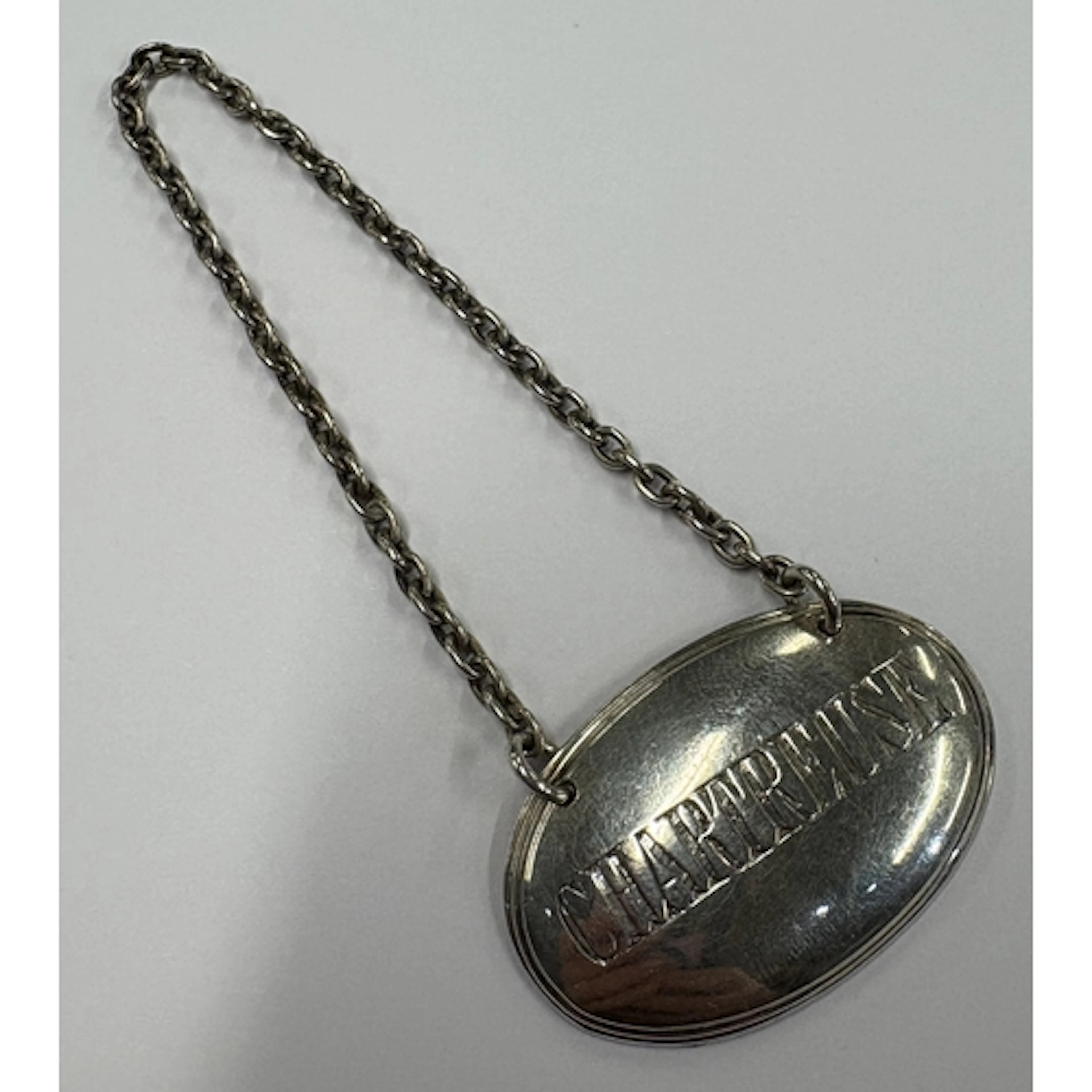 A rare Victorian silver decanter label for 'Chartreuse'. Lon...
