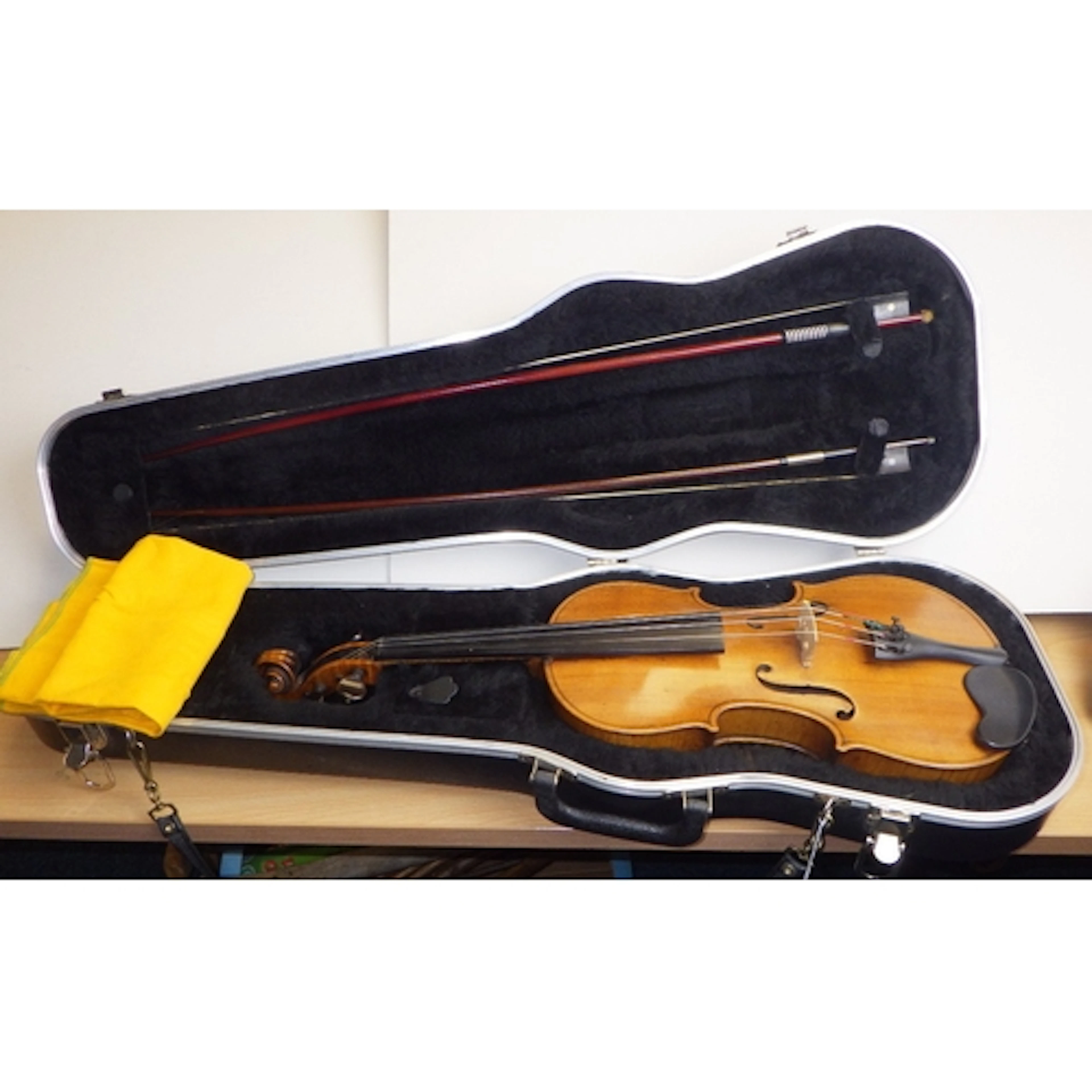 A cased violin: 'Antonius Stradivarius Cremonensis Faciebat ...
