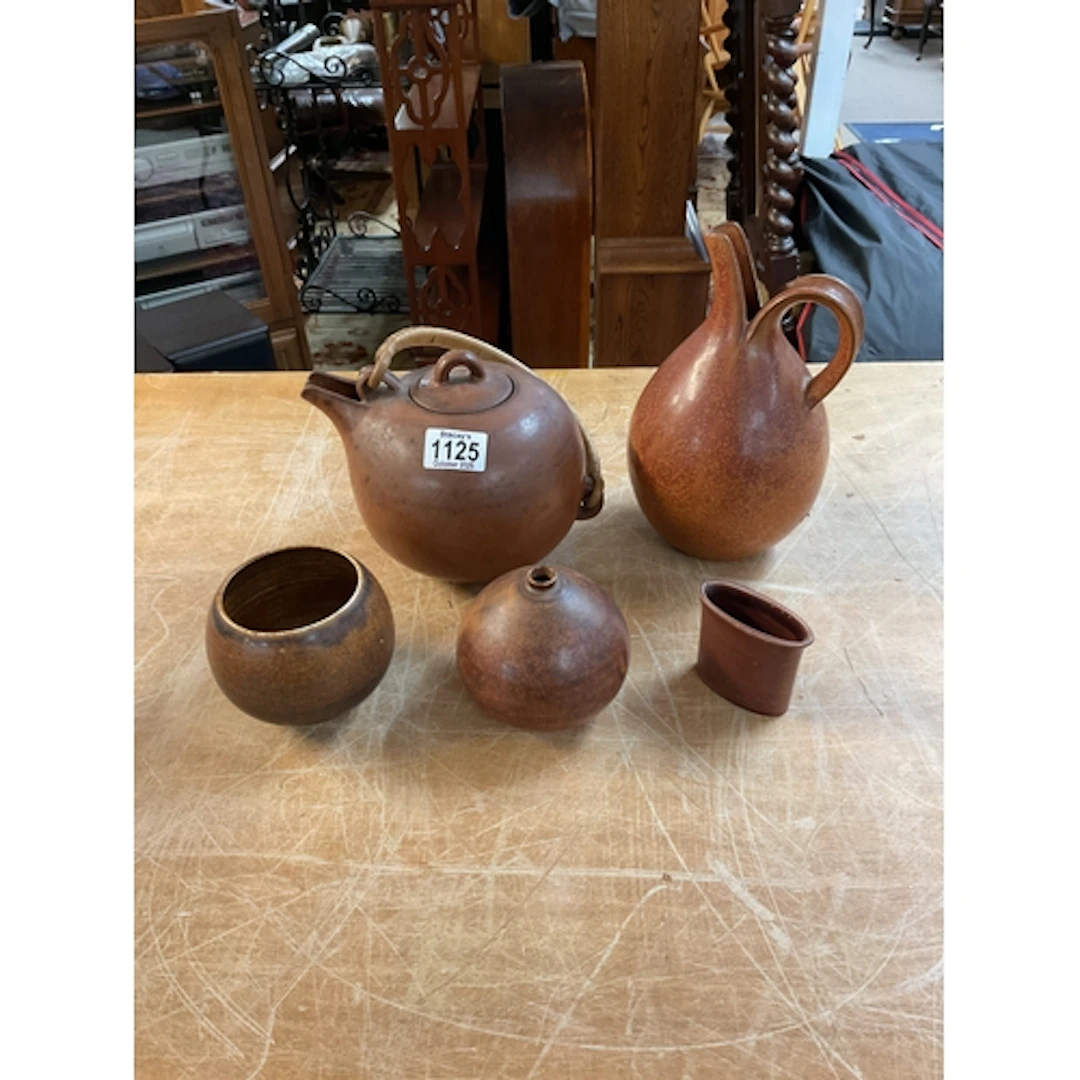 Four pieces of Danish Saxbo ceramics, along with one other .