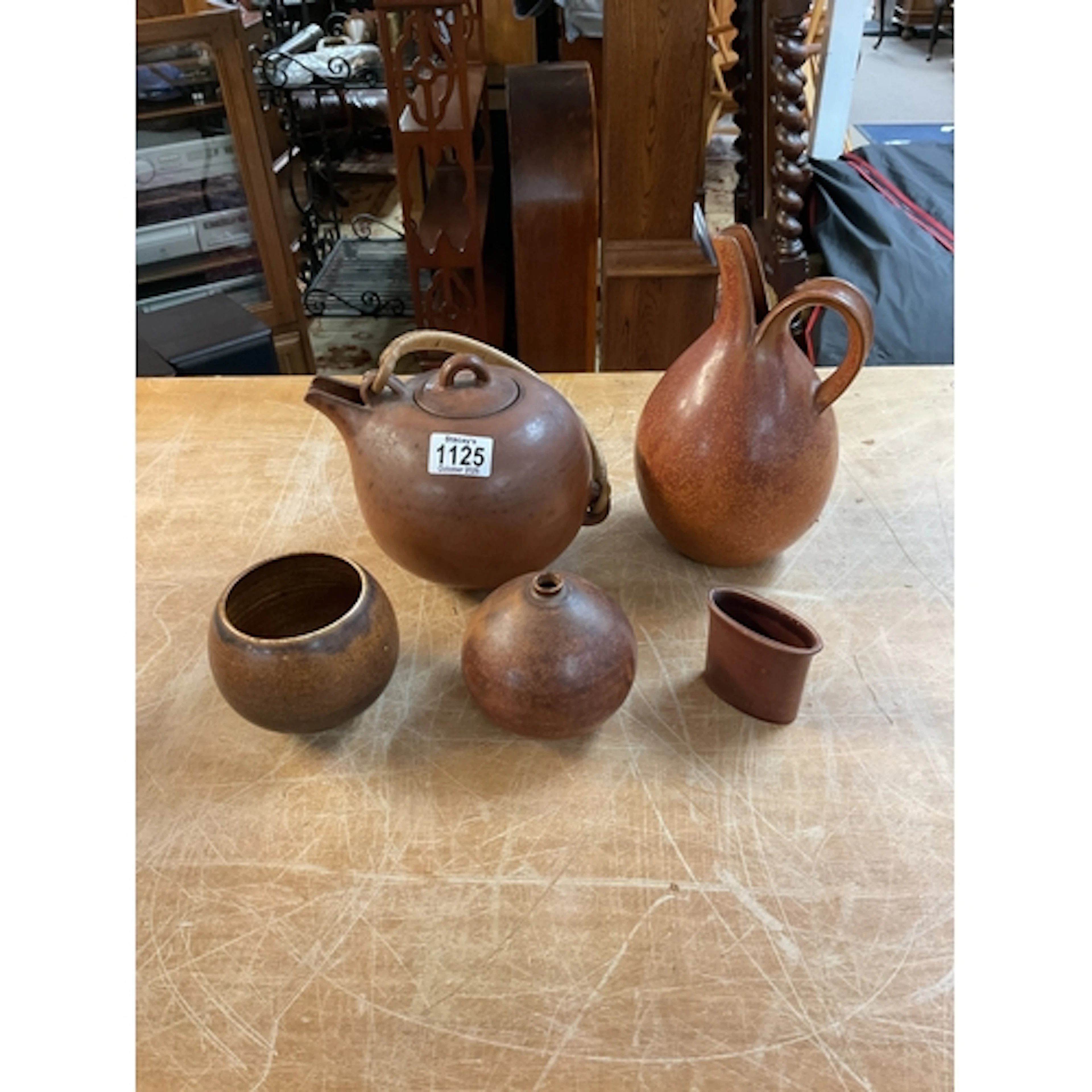 Four pieces of Danish Saxbo ceramics, along with one other .