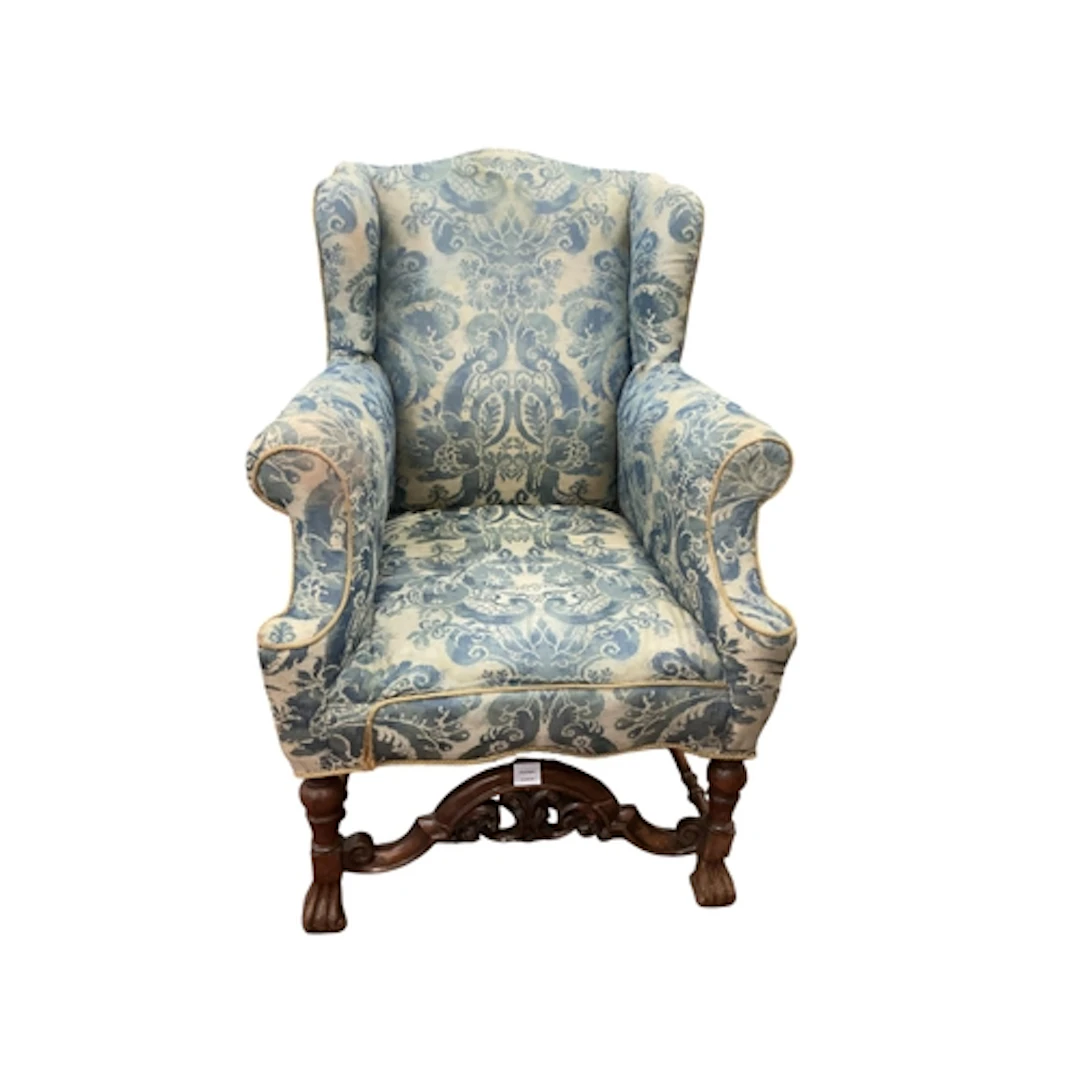 A William and Mary style walnut upholstered wing armchair, w...