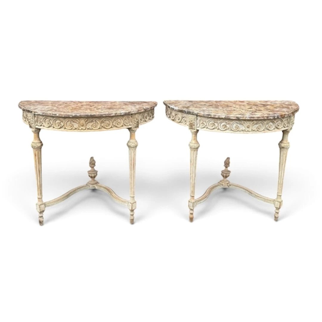 A MATCHED PAIR OF PAINTED DEMI LUNE TABLES With simulated ma...