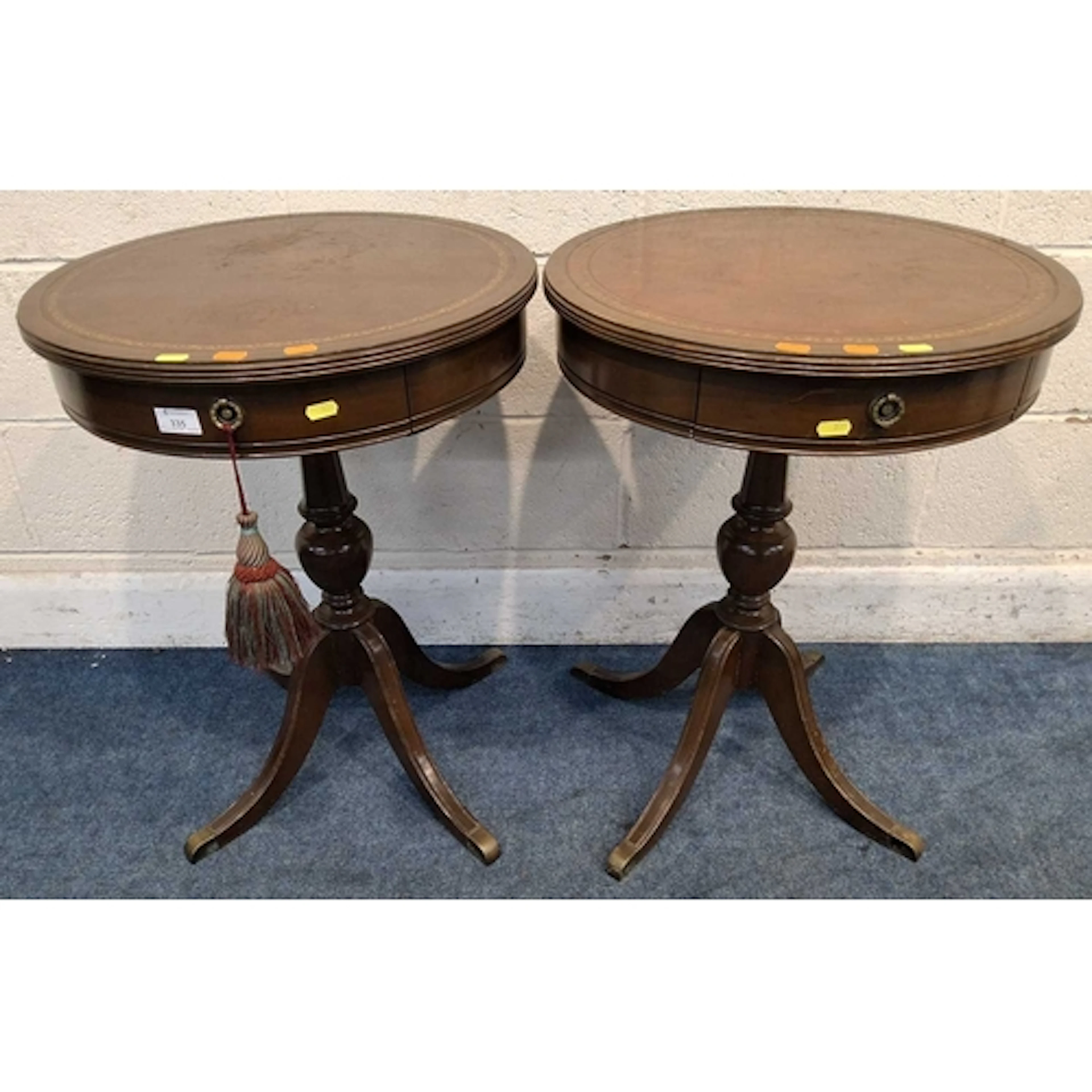 A PAIR OF REPRODUCTION MAHOGANY TABLES, with leather surface...