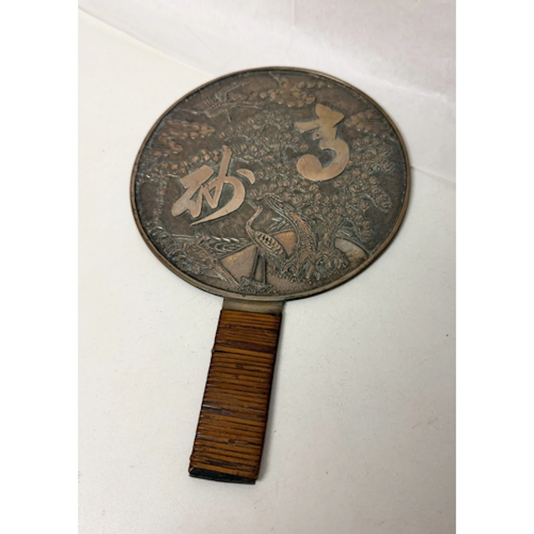 A Japanese polished bronze bronze hand mirror