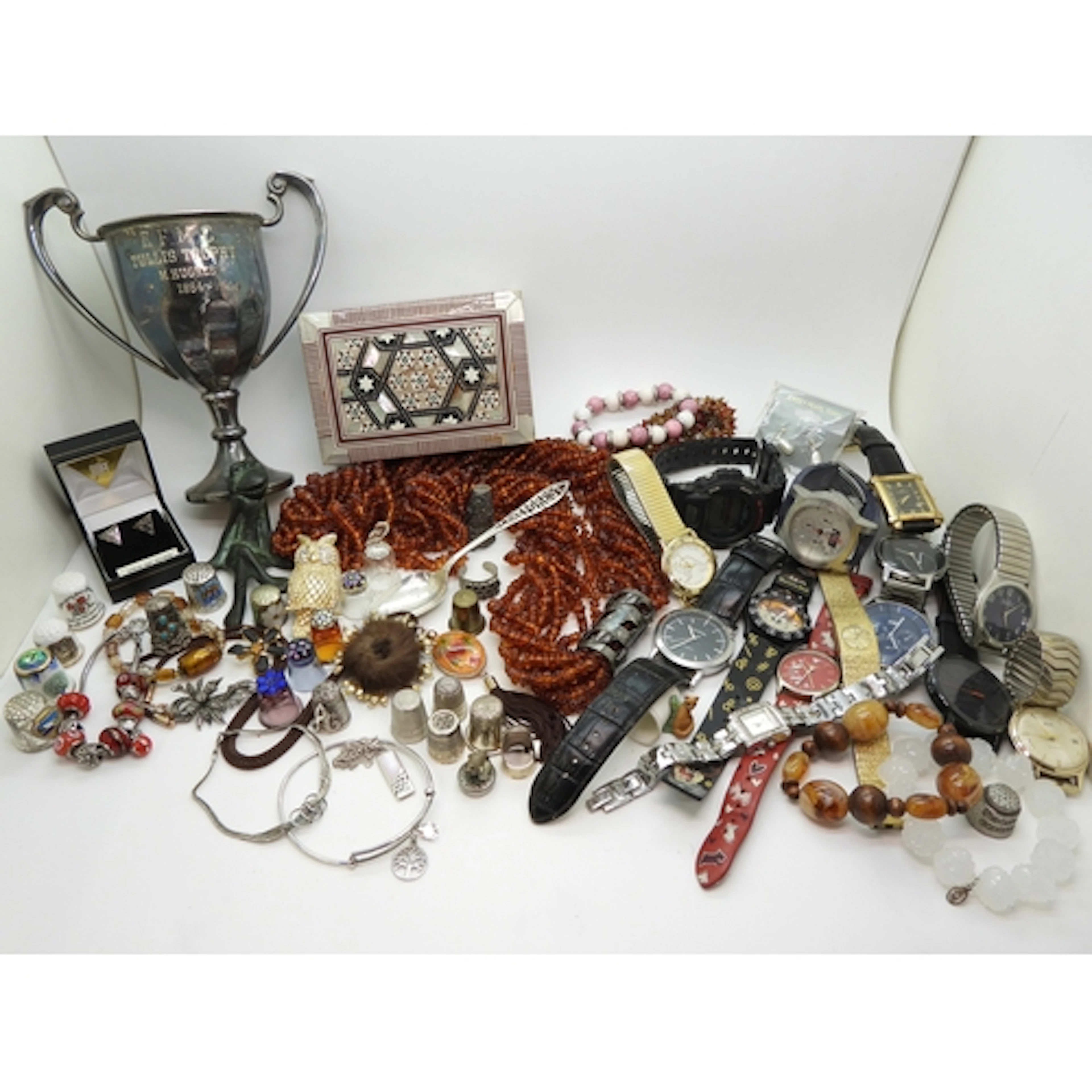 A statement amber chip necklace, a silver spoon, a collectio...