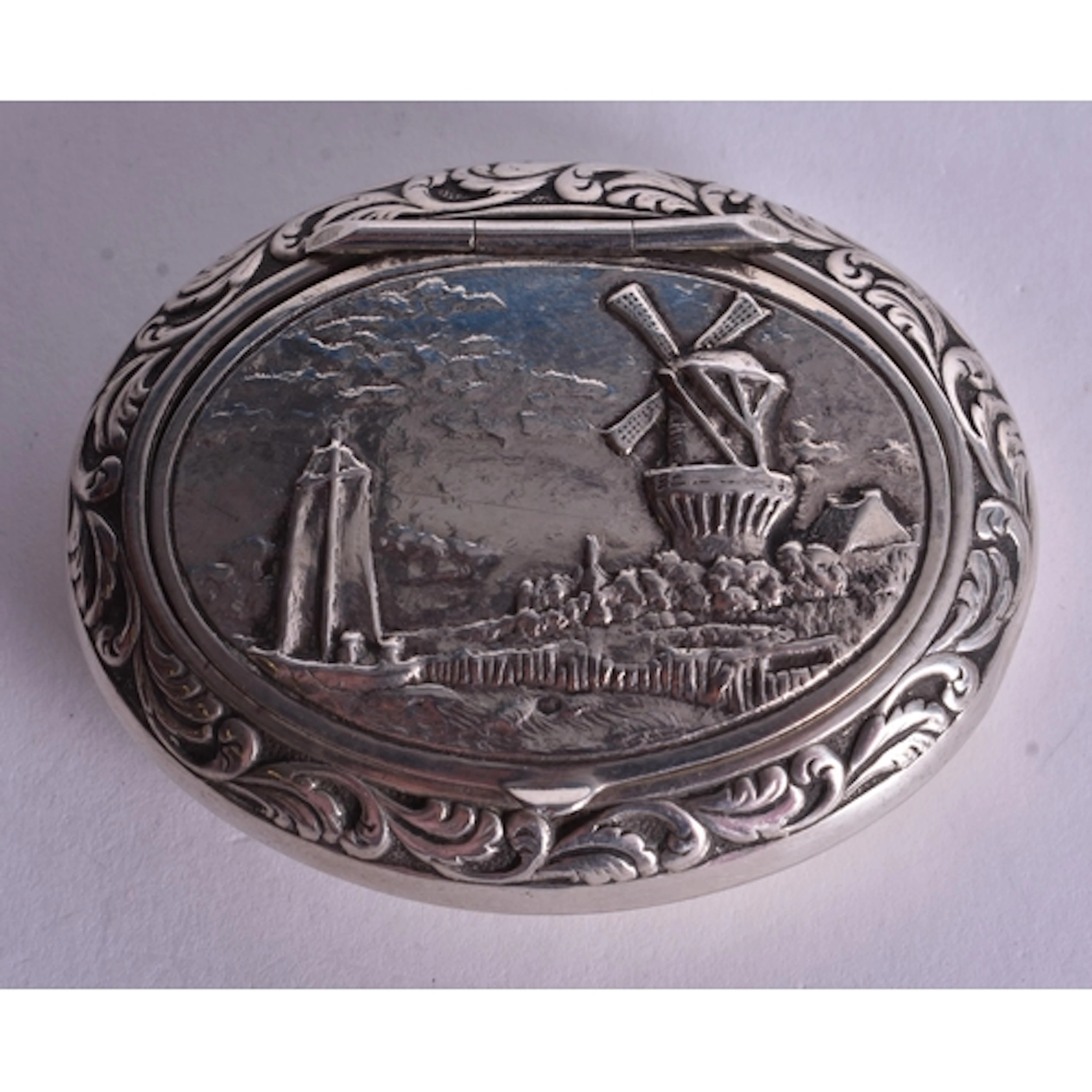A Dutch Silver Snuff Box with an embossed Dutch Landscape on...
