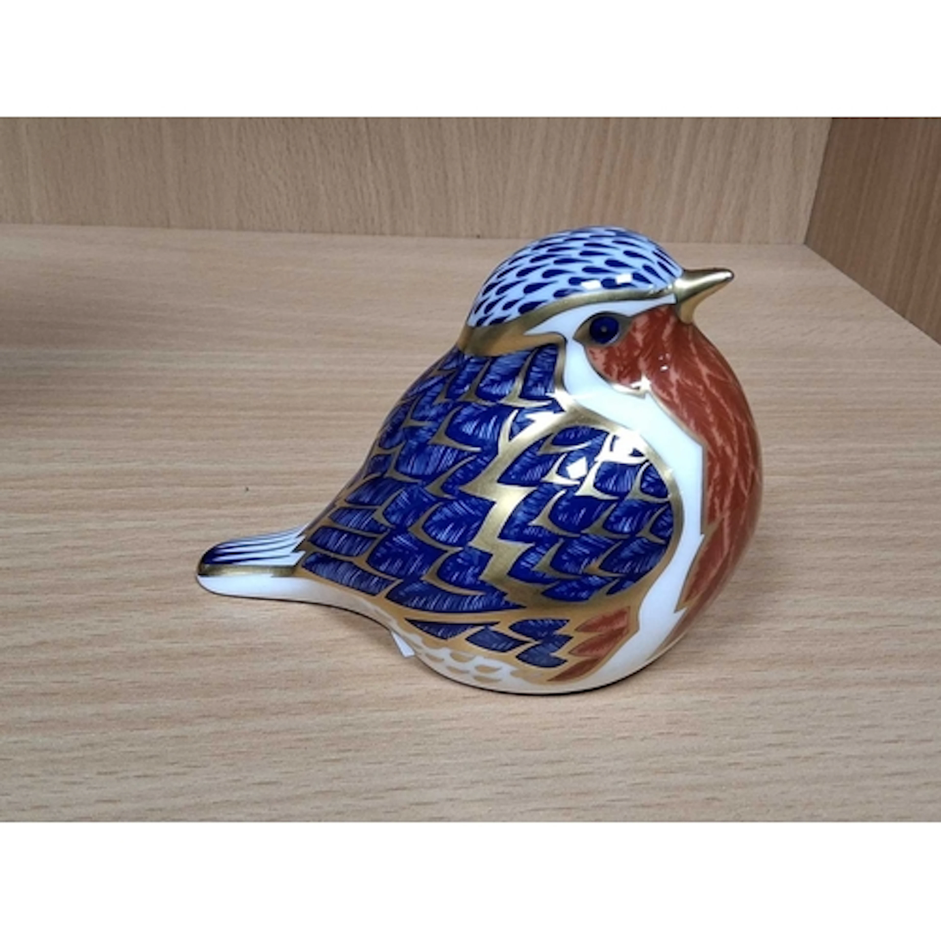 A ROYAL CROWN DERBY ROBIN PAPERWEIGHT, with gold stopper (1)...