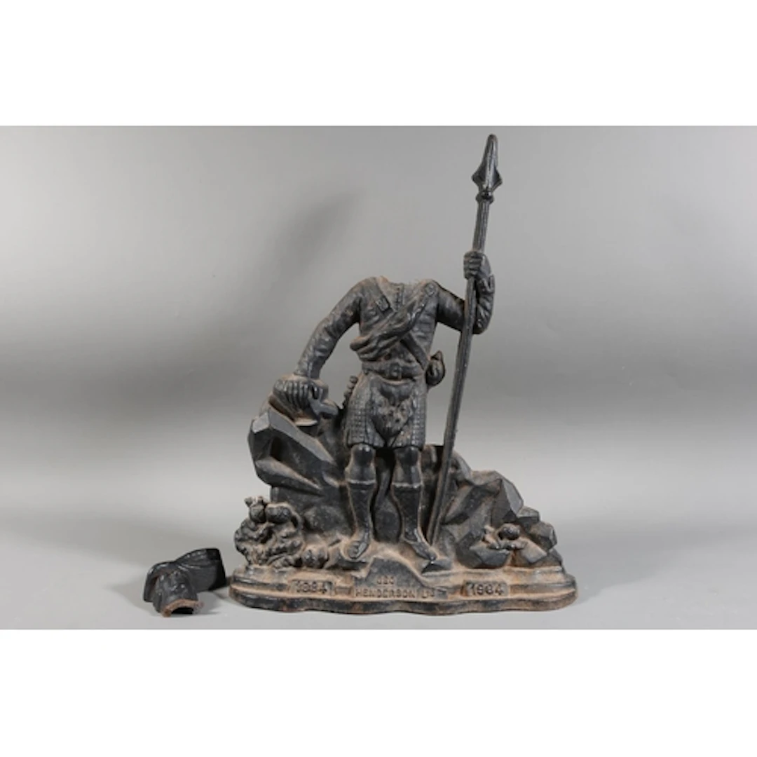 Cast doorstop modelled as a Highlander, marked 1884-1984, Ge...