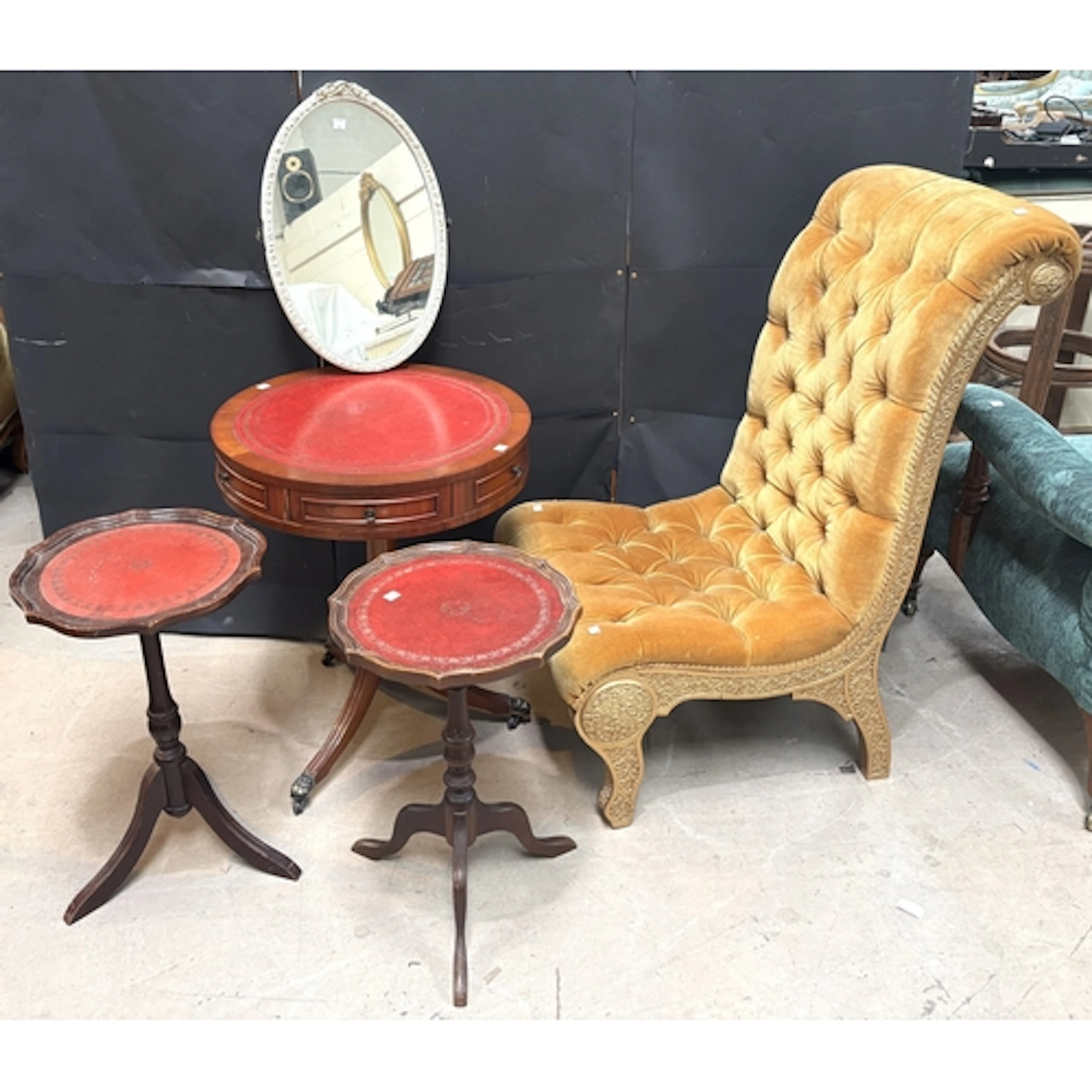 A mahogany drum table on tripod base with red leather insert...
