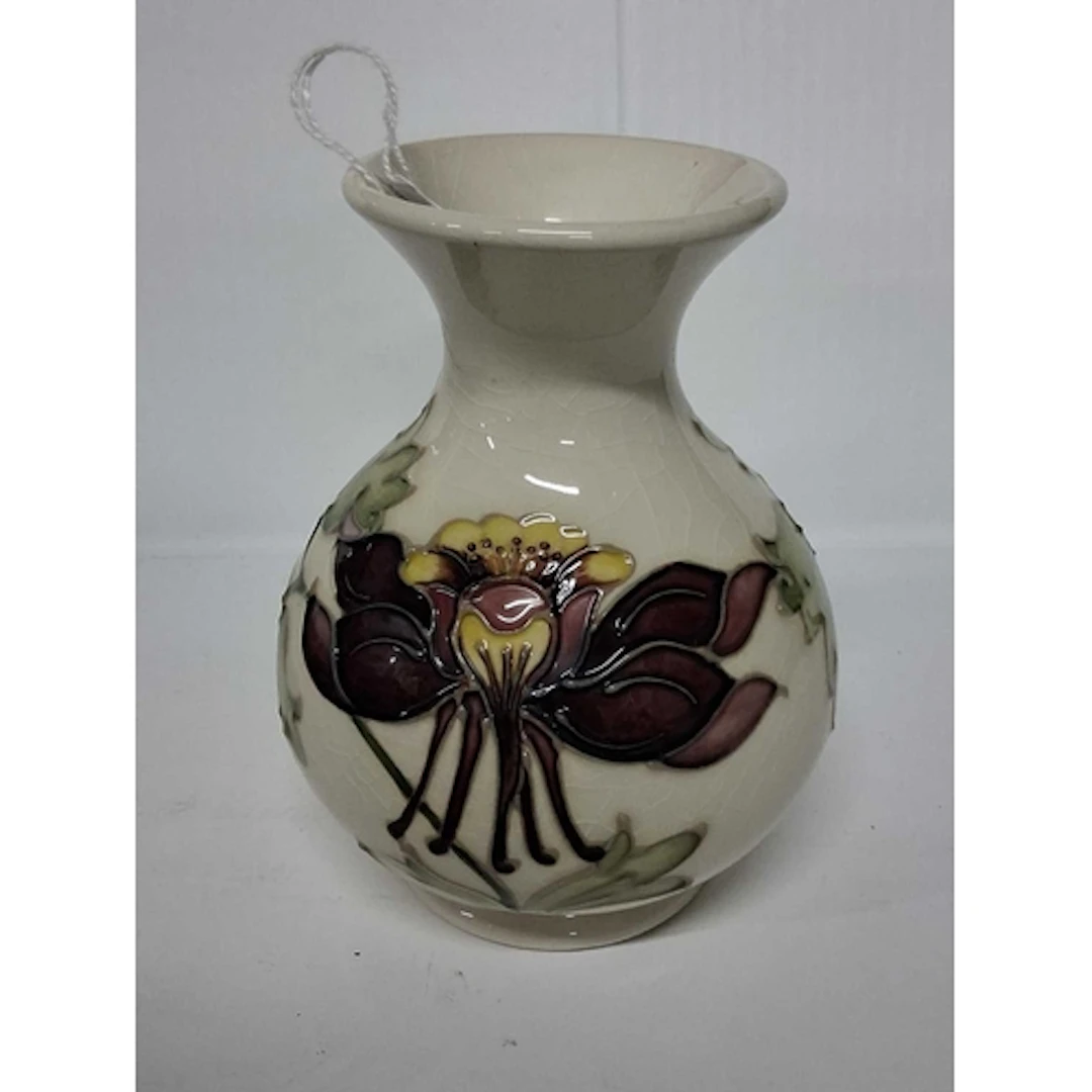 A MOORCROFT POTTERY COLUMBINE BALUSTER VASE, tube-lined with...