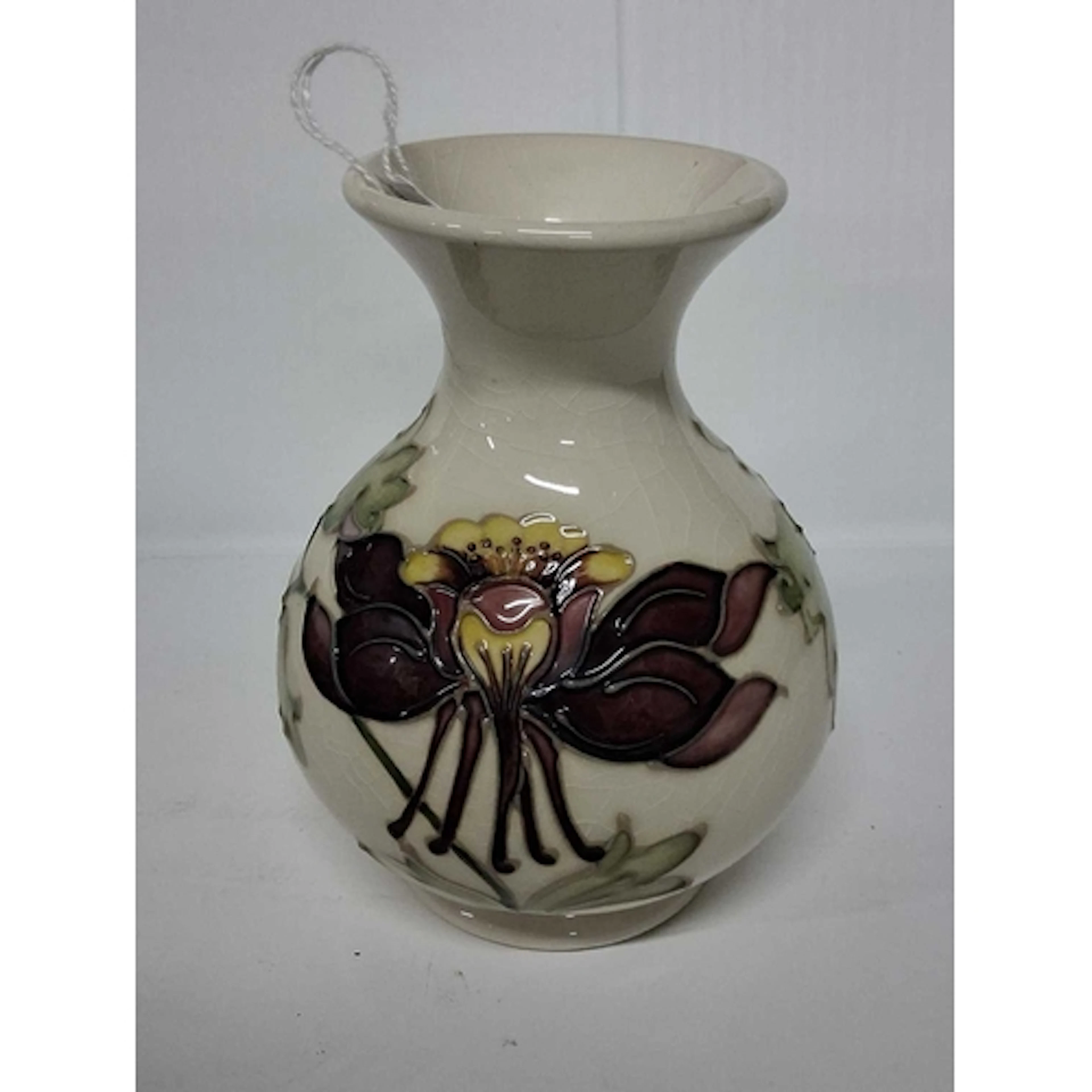 A MOORCROFT POTTERY COLUMBINE BALUSTER VASE, tube-lined with...