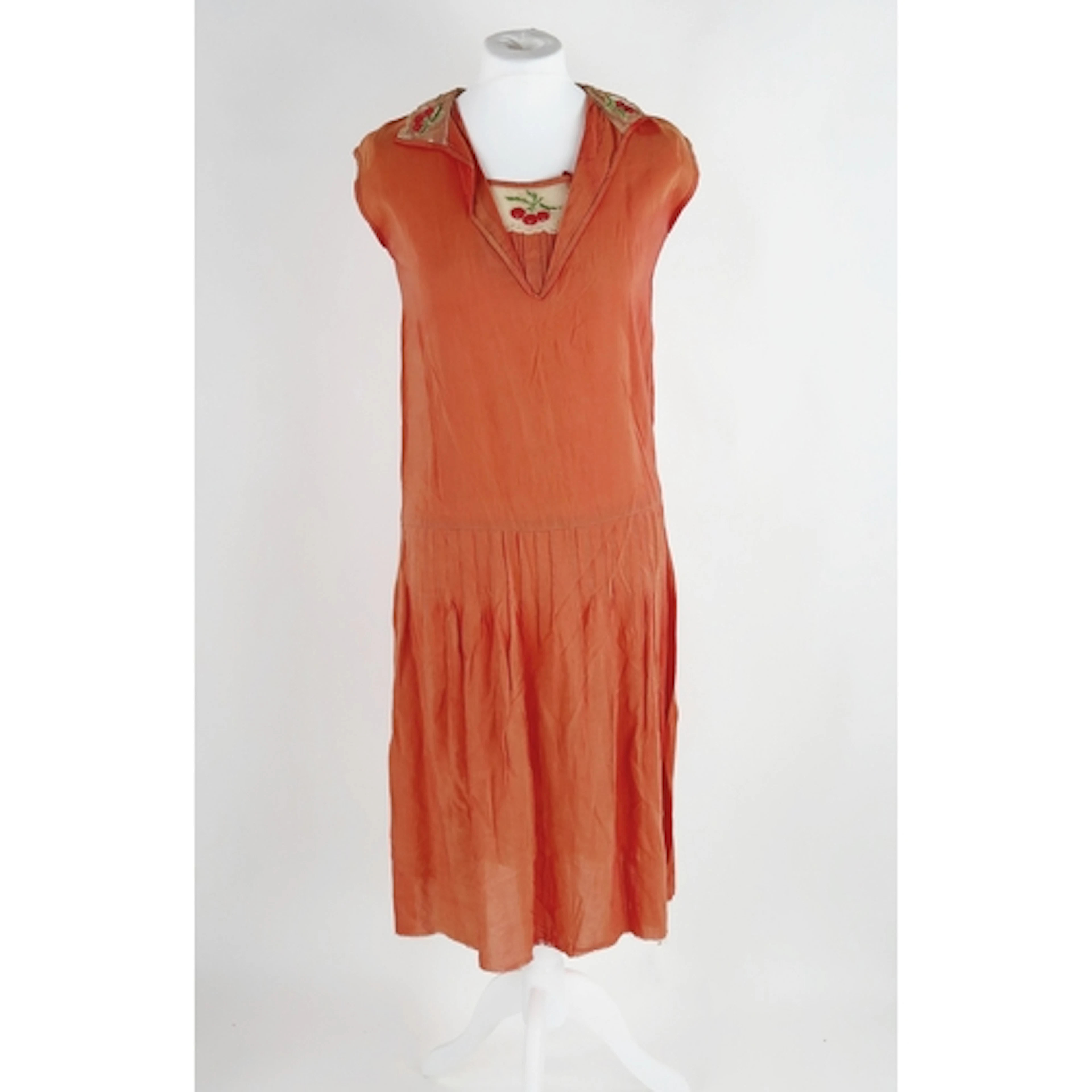 An Art Deco period lady's shift dress in coral pink, with ha...