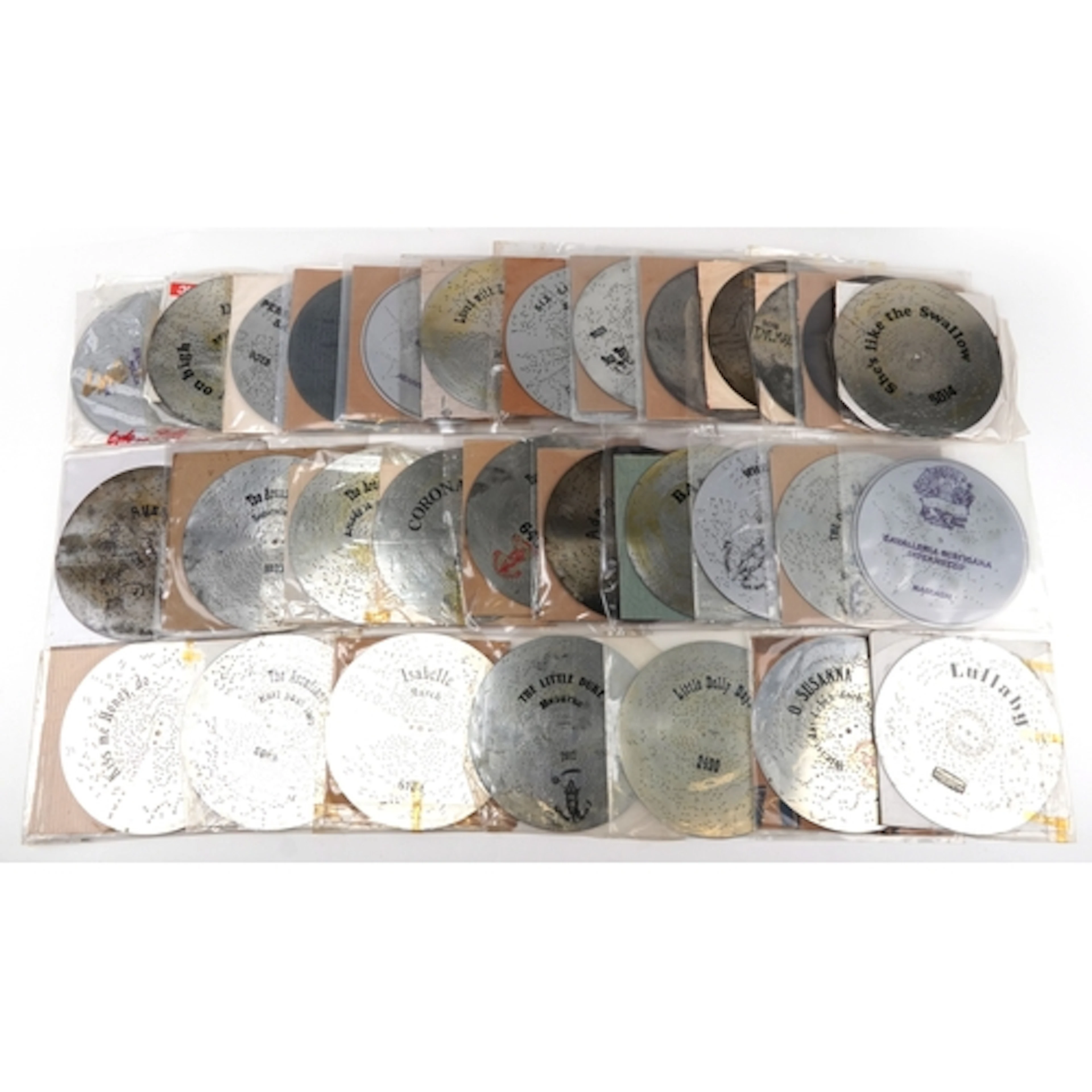 Collection of Polyphon music discs including The Waters of t...