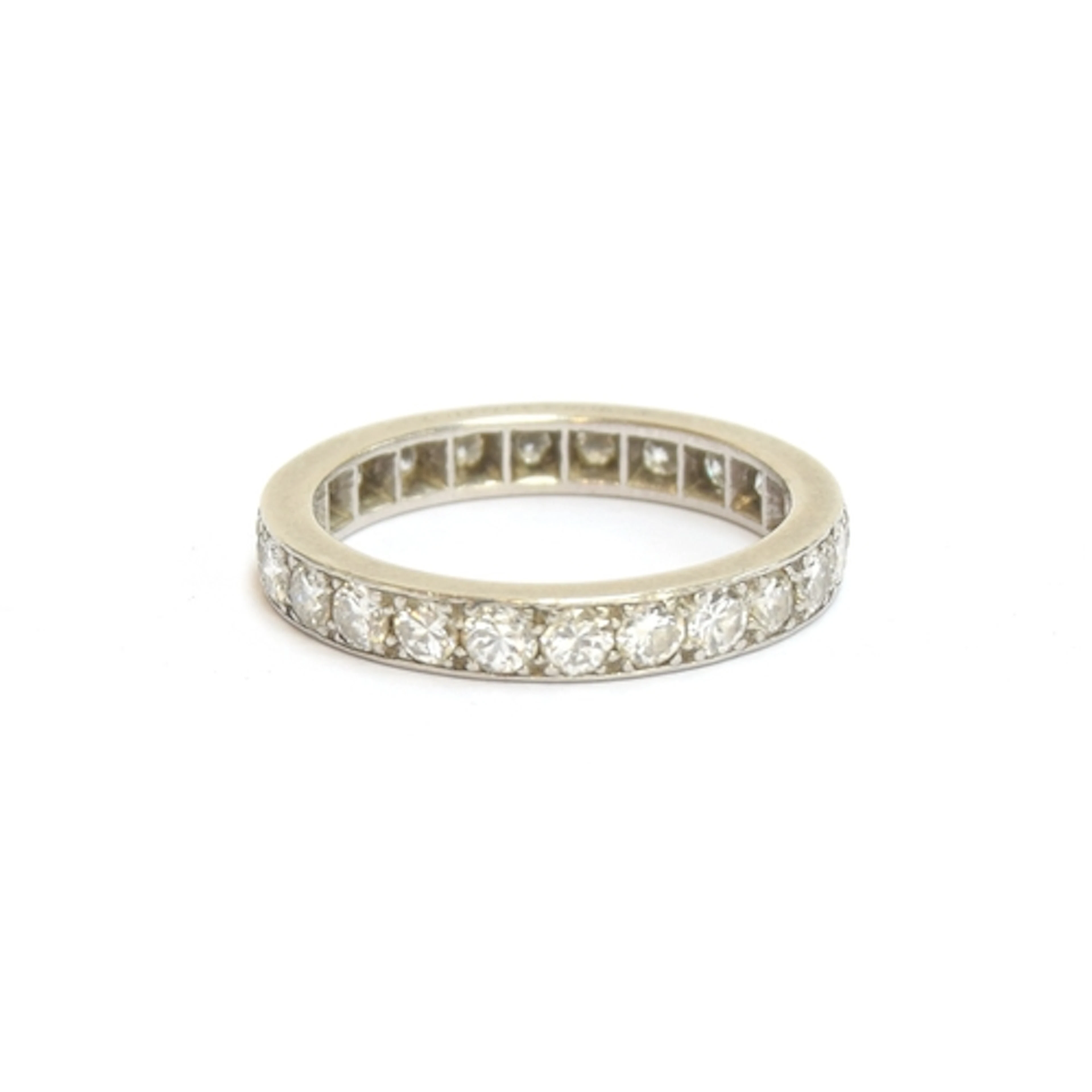 A Cartier platinum and diamond full eternity ring, engraved ...