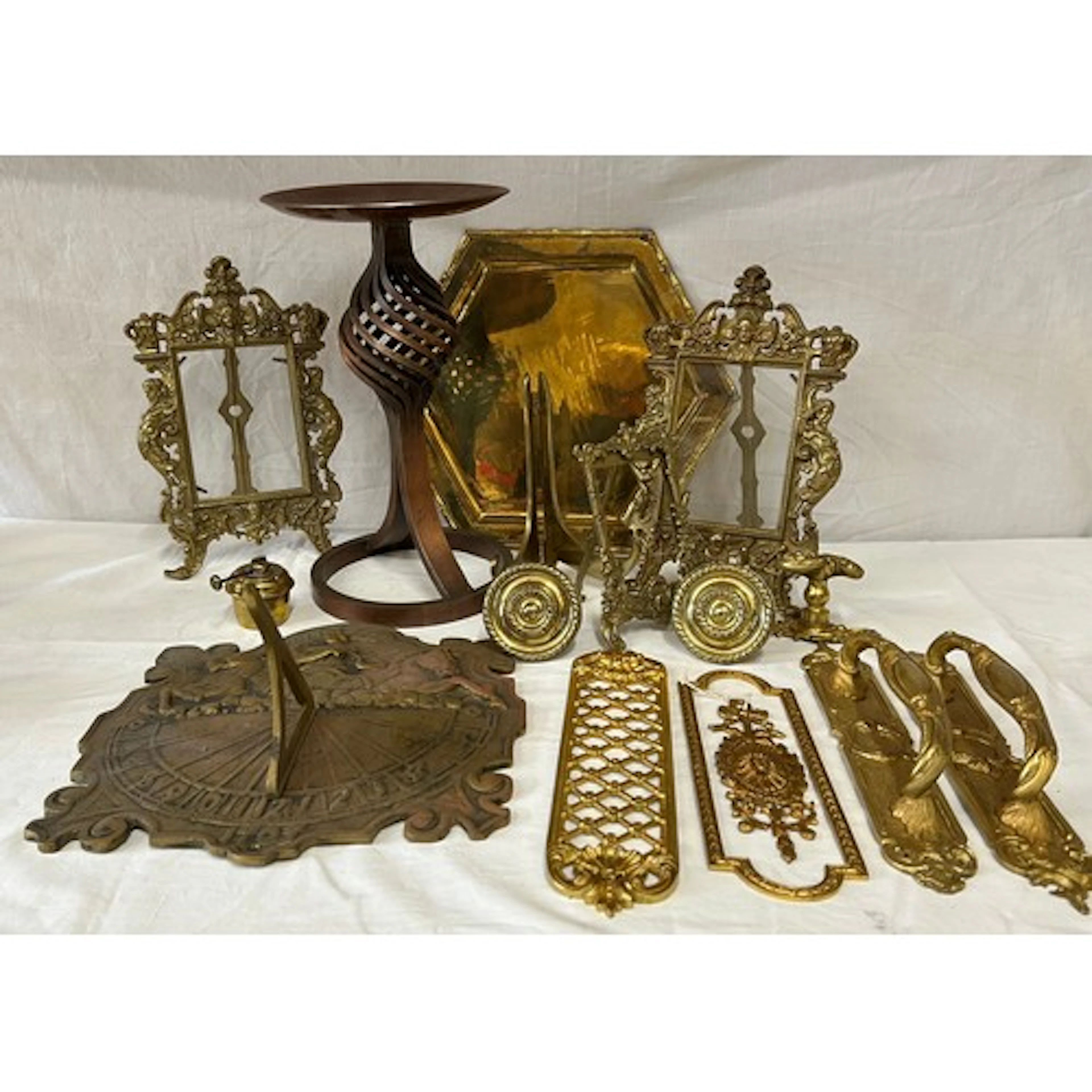 A miscellany of brass to include an iron church candle holde...