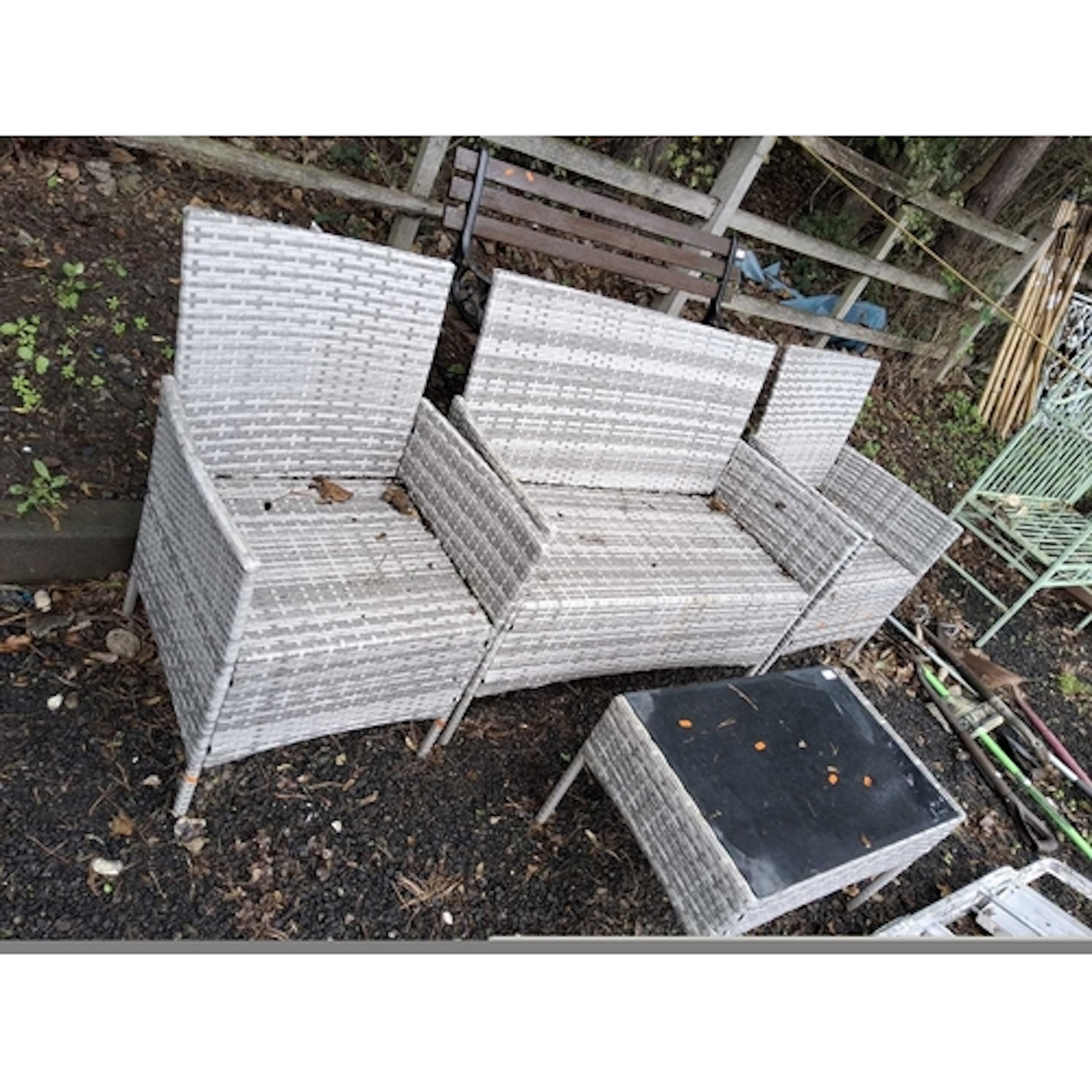 A RATTAN EFFECT FOUR PIECE GARDEN SUITE with 102cm wide sofa...