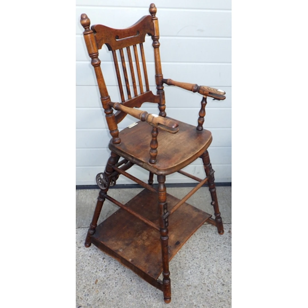 An Edwardian Briggs & Sons high chair, missing rail together...