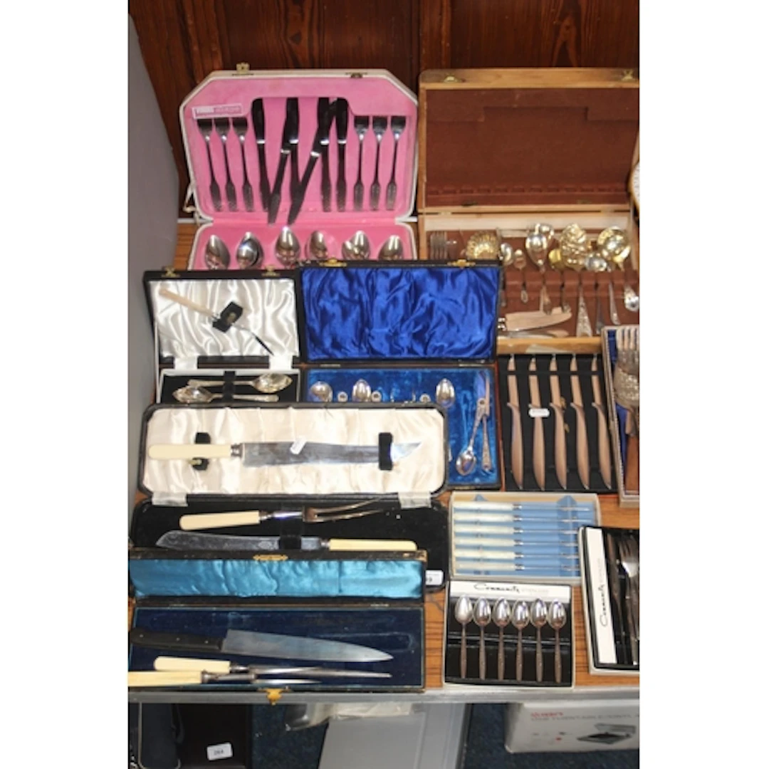 Cased sets of silver plated flatware to include carving sets...