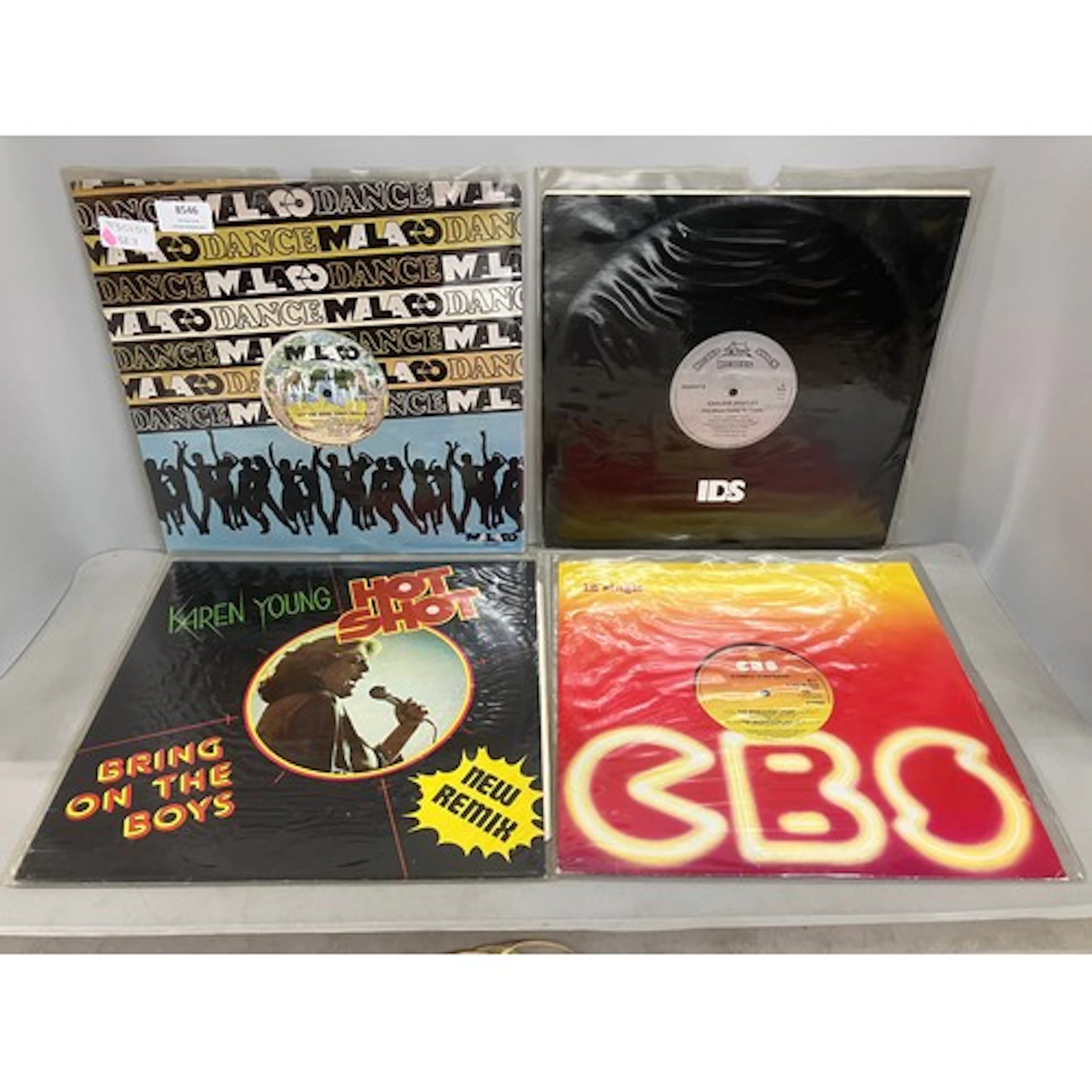 Thirteen assorted vinyl LP records and 12" singles to includ...
