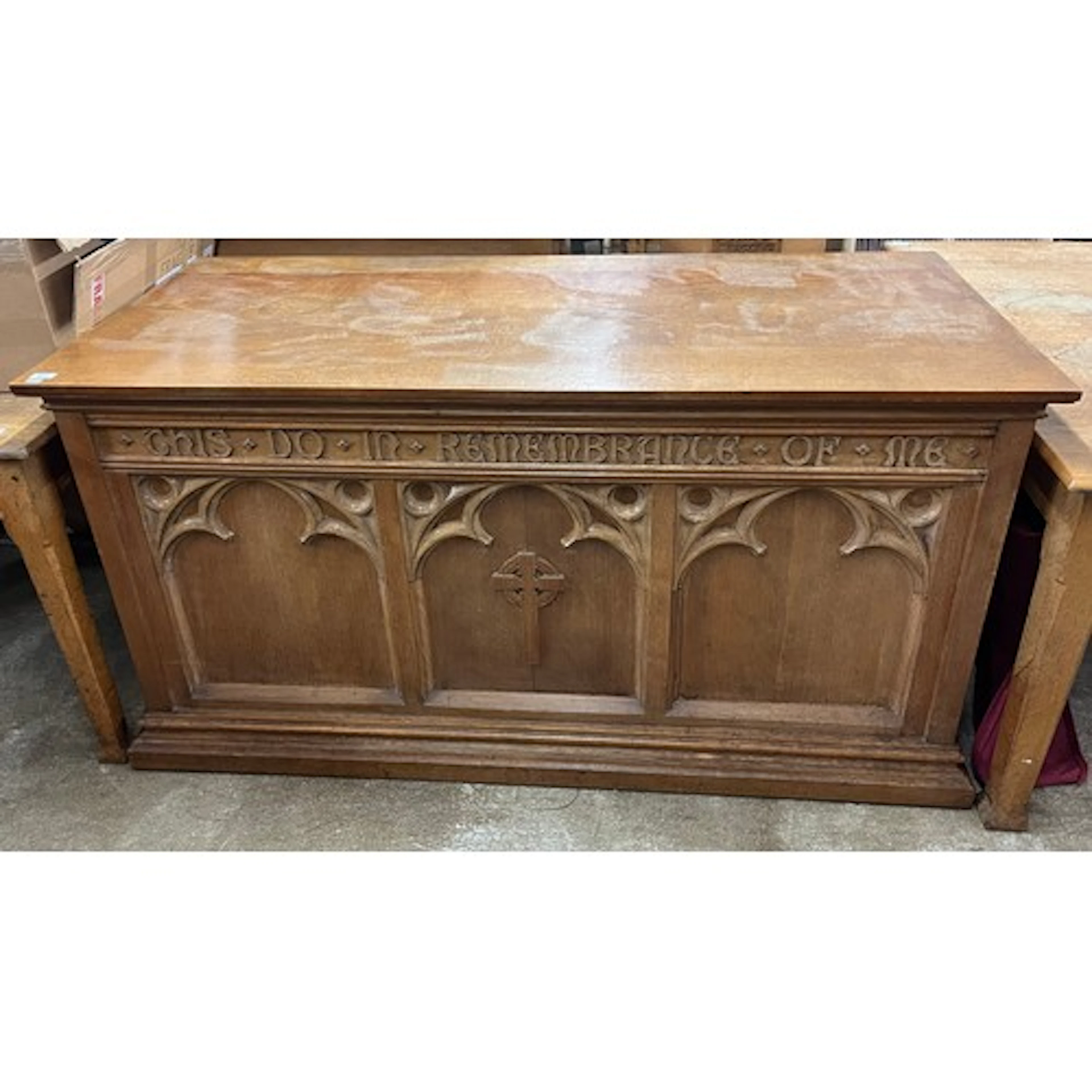 Carved oak alter with tracery carving to front, 168cm L.