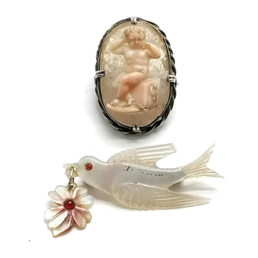 Antique hand carved coral cameo of a seated cupid chained to...