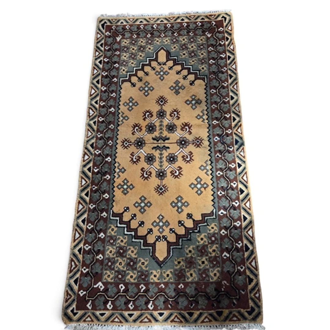 A Tunisian hand woven wool Rug with brown and rust tones. 20...