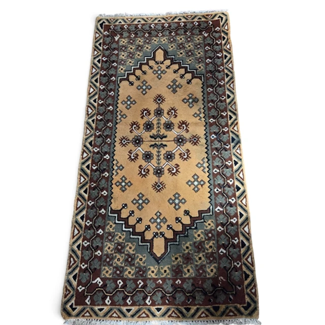 A Tunisian hand woven wool Rug with brown and rust tones. 20...
