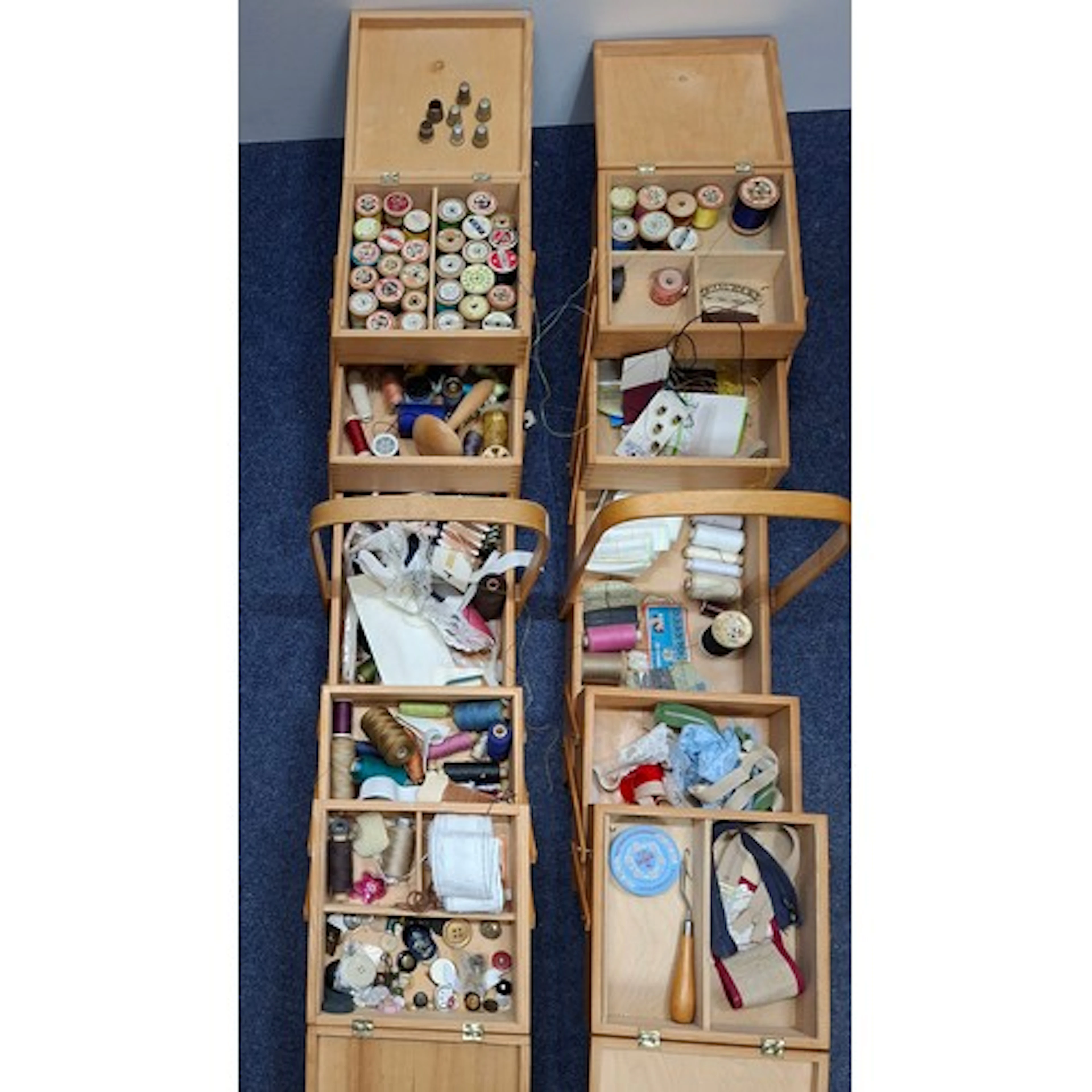 Two late 20th Century treen concertina sewing boxes, a small...