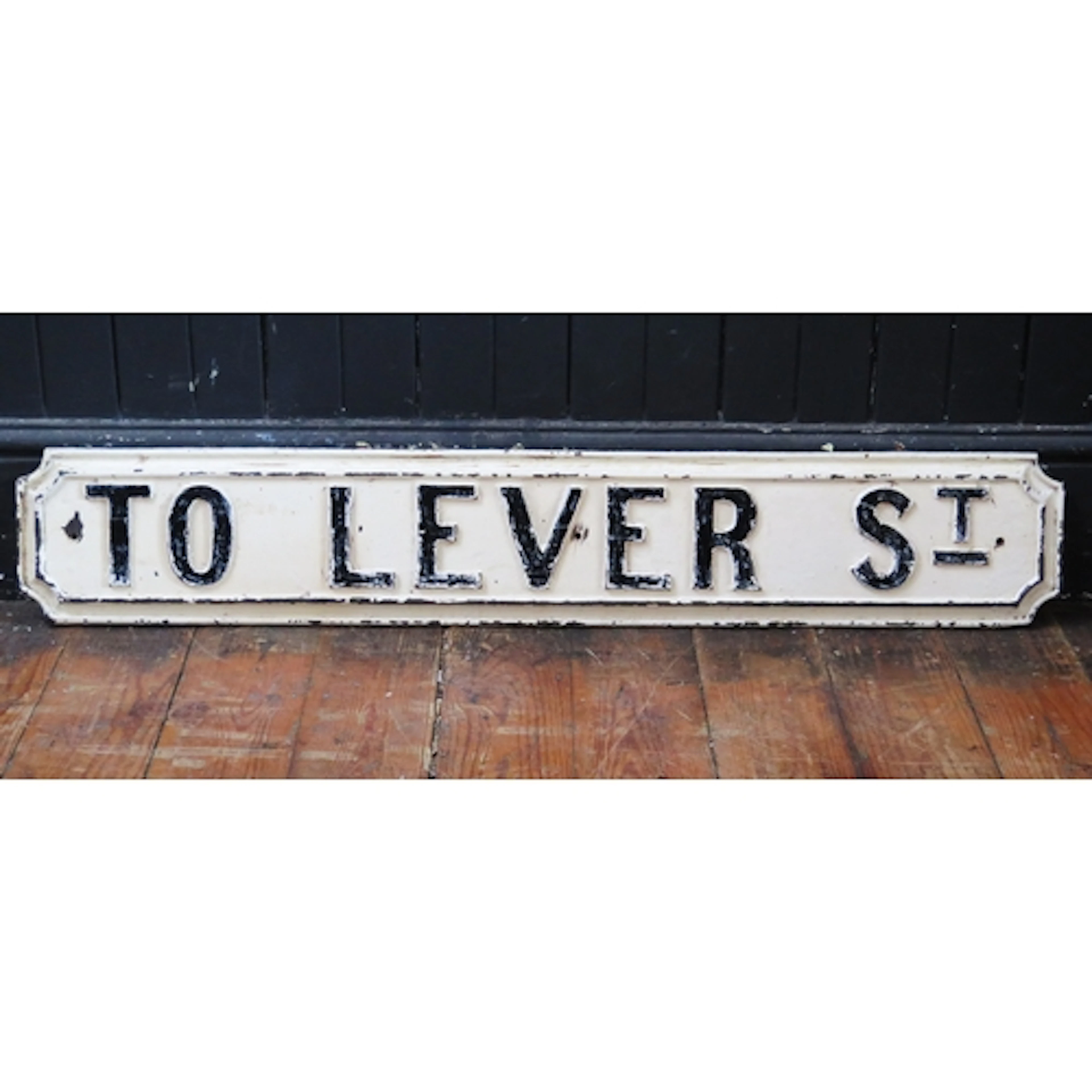 "To Lever St" - a black and white painted cast iron street s...