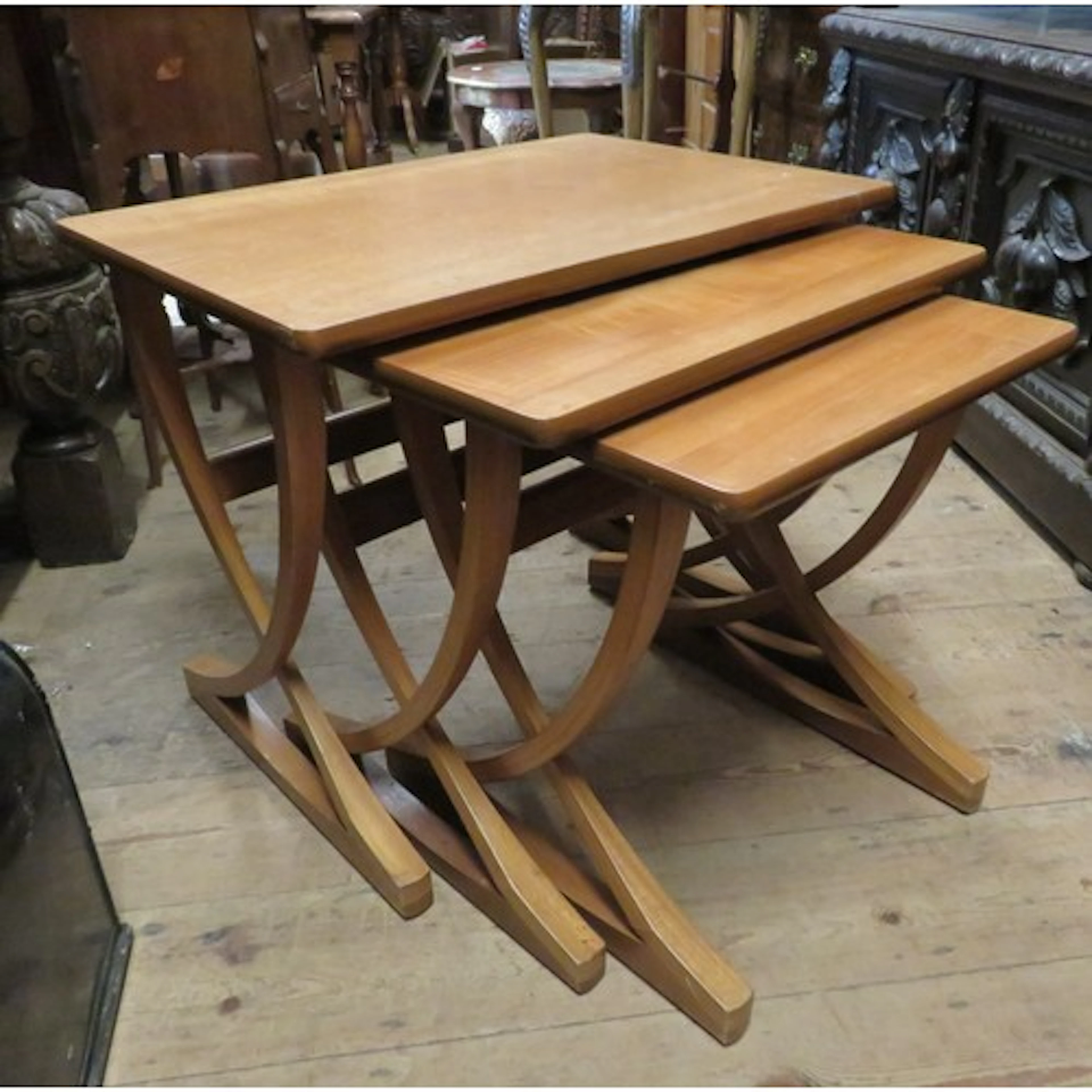 Nest of three mid 20th Century teak occasional tables, by Na...