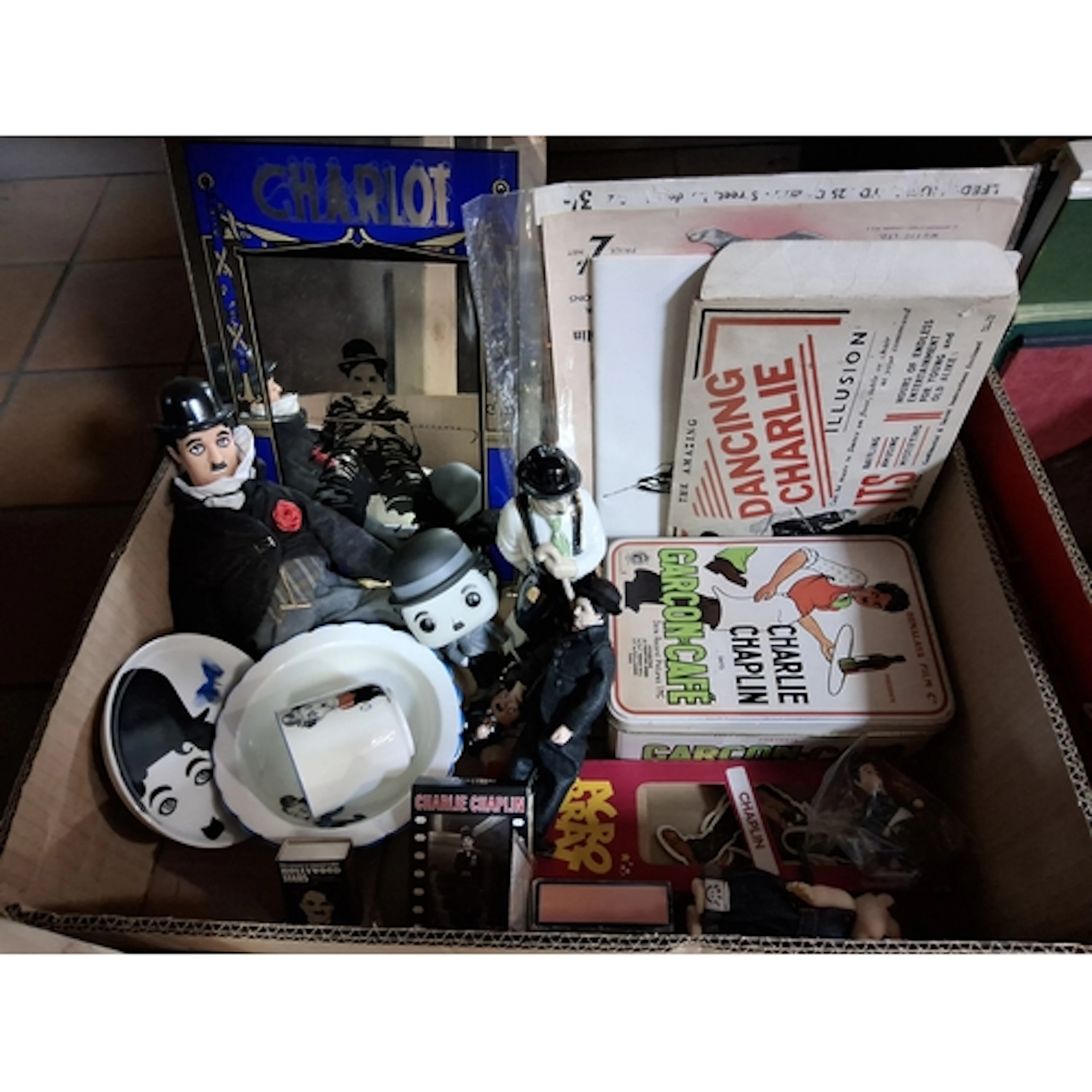 A BOX OF CHARLIE CHAPLIN MEMORABILIA, modern and vintage ite...