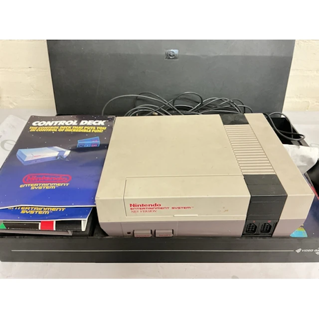 A Nintendo Entertainment System In Case With Games And Acces...