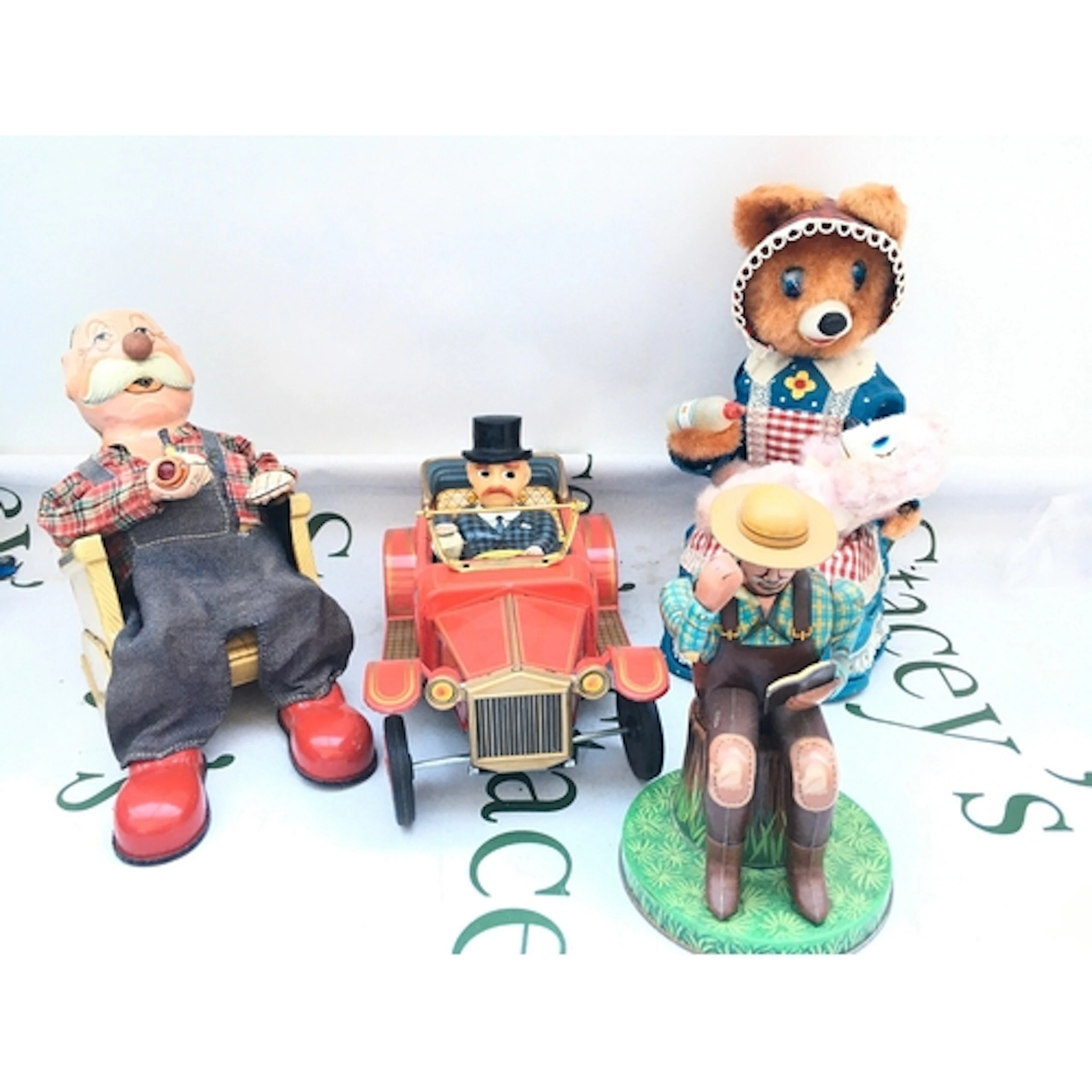4 X Battery Operated Tinplate Toys. A Smokin Grandpa, A Oldt...