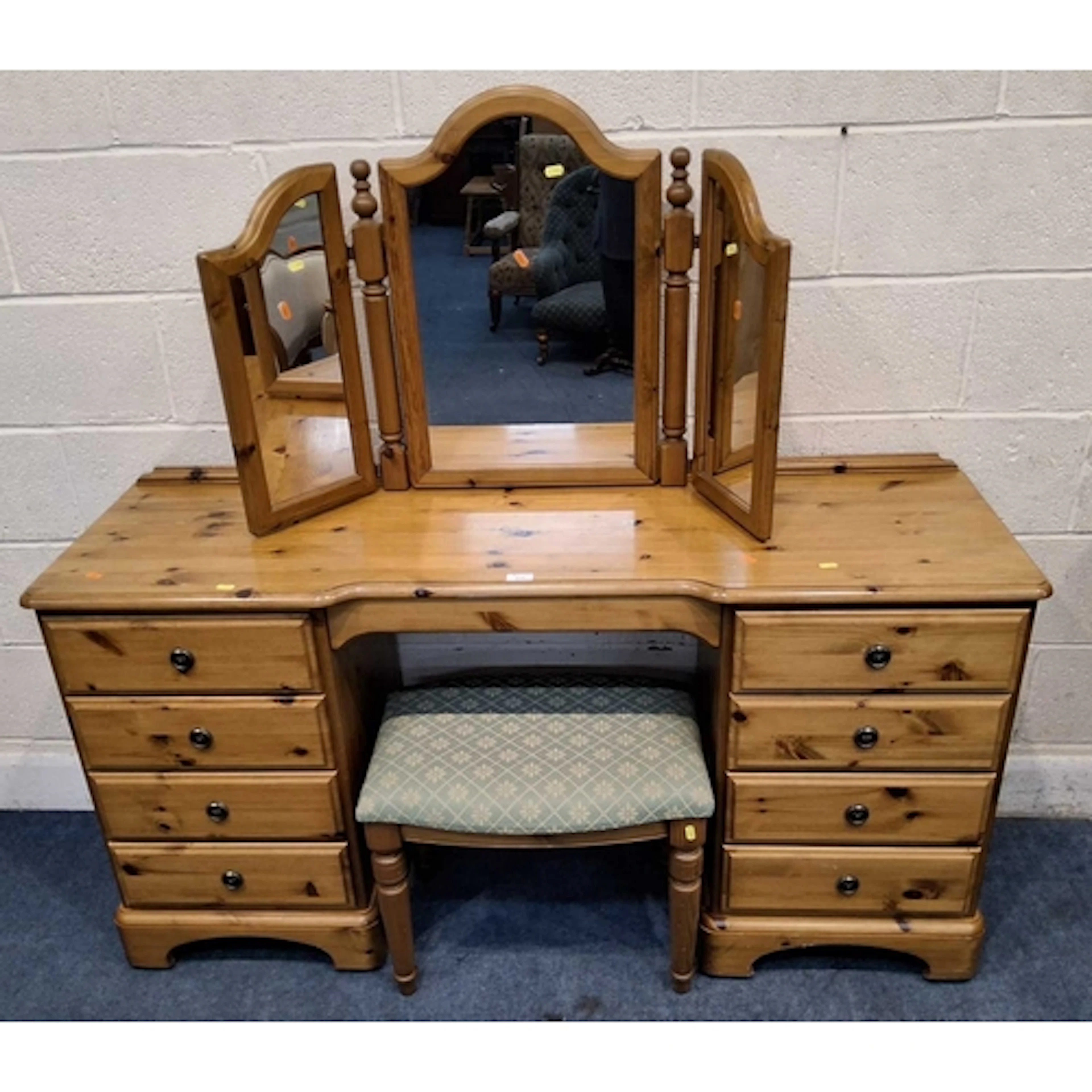A DUCAL PINE DRESSING TABLE, with nine assorted drawers, rai...