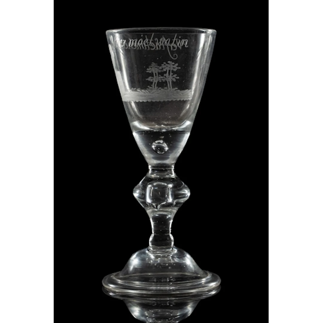 A Dutch engraved light baluster wine glass, 18th century the...