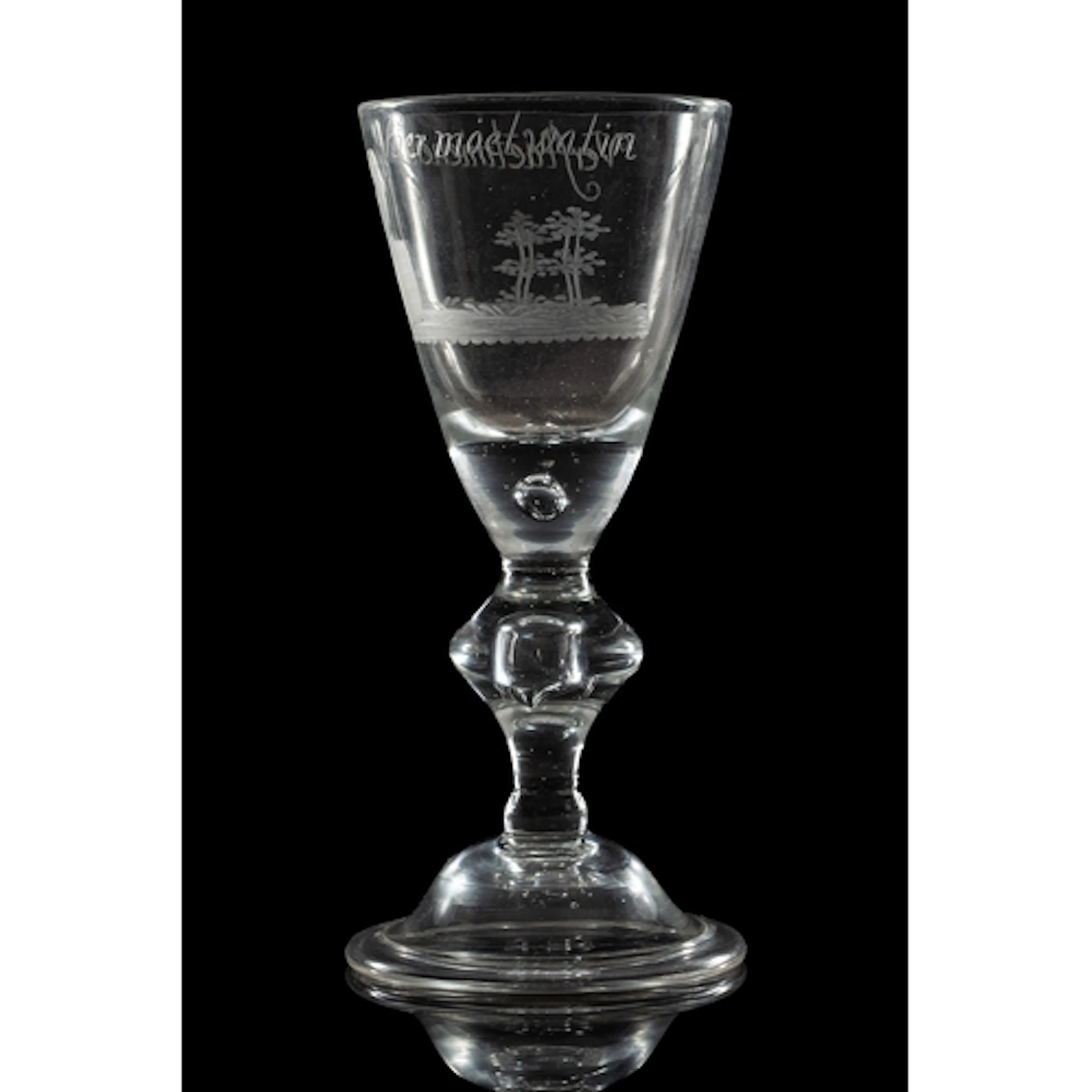 A Dutch engraved light baluster wine glass, 18th century the...