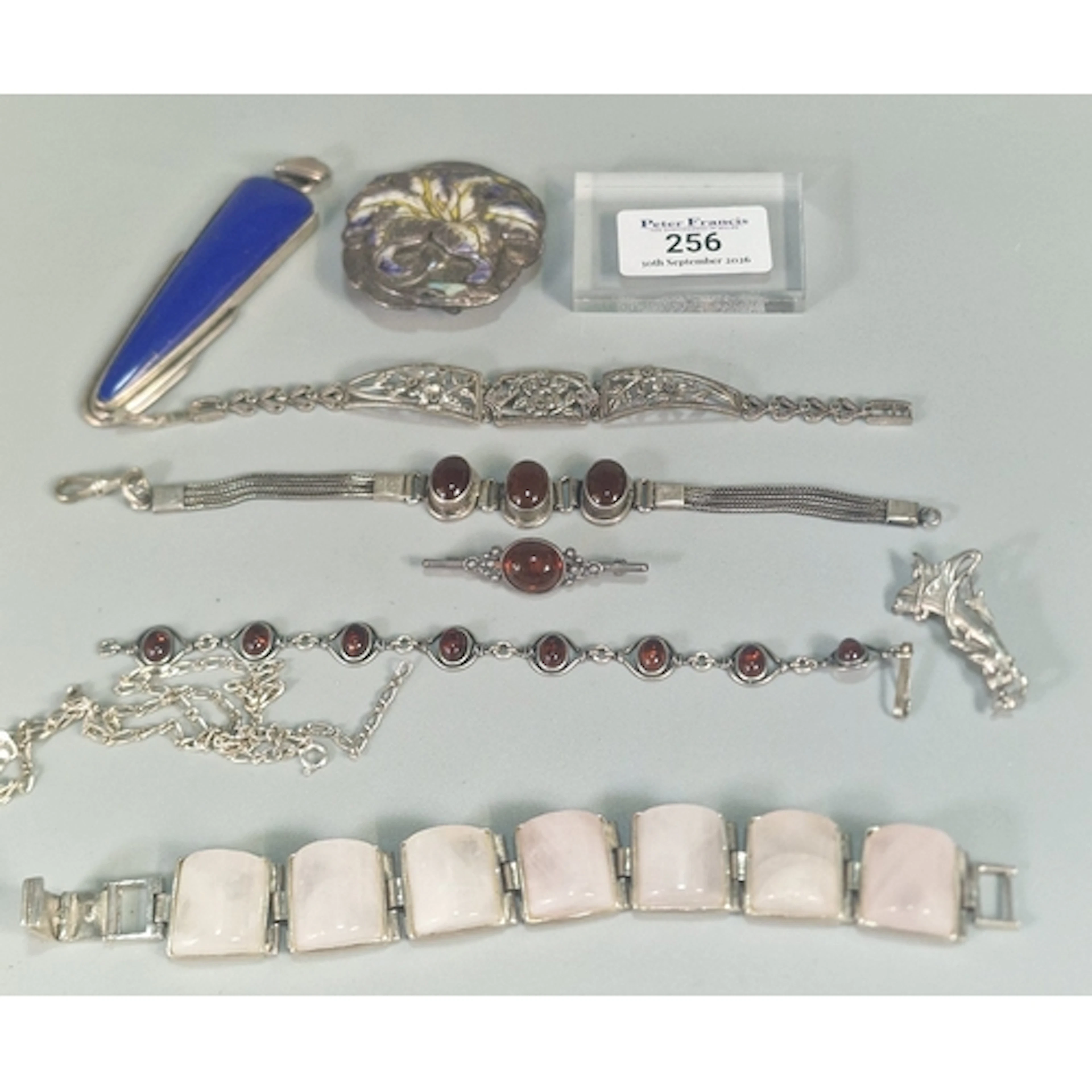 Collection of Modernist silver jewellery to include: pierced...