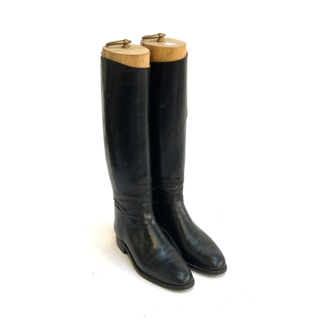 A pair of ladies black leather hunting boots made by John Lo...