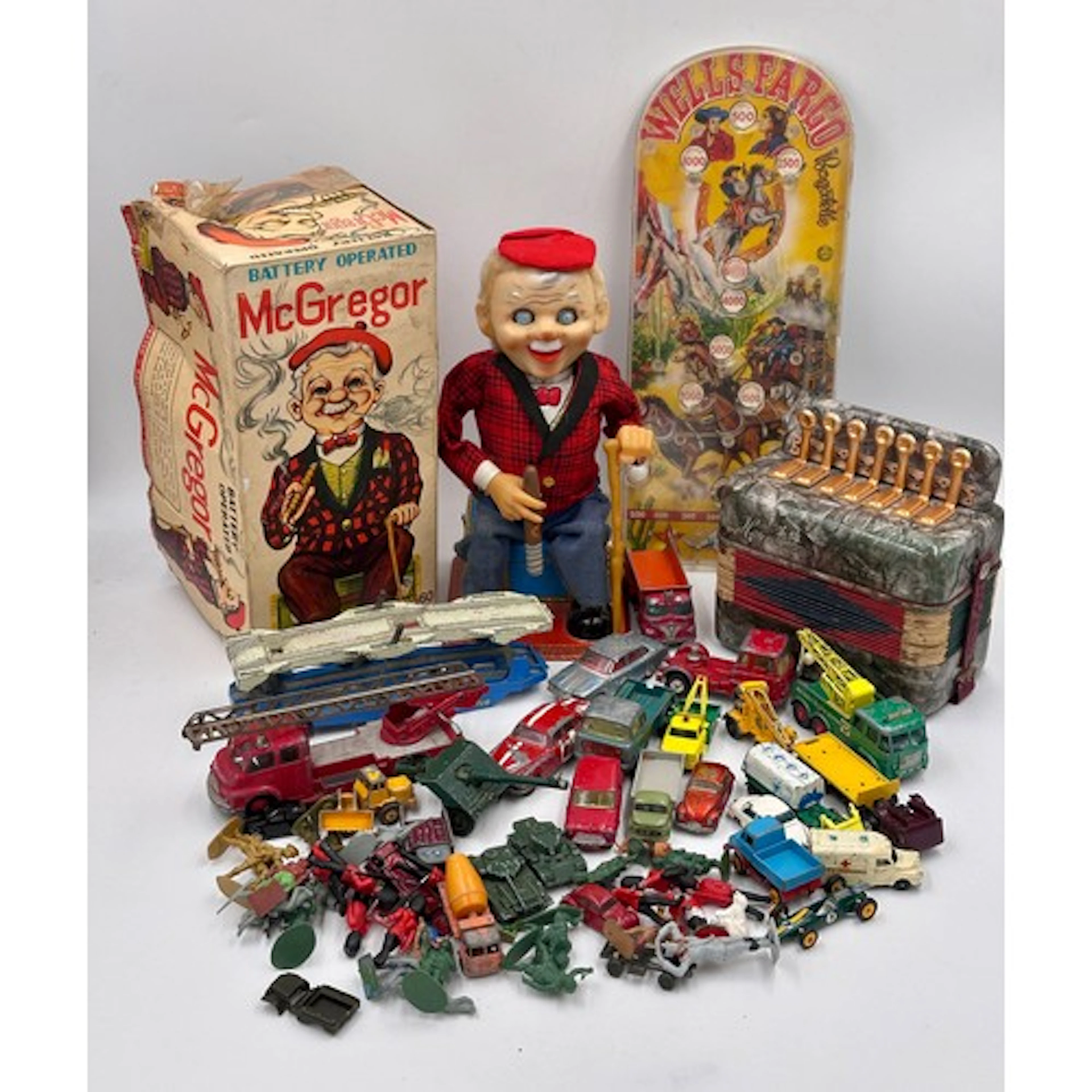 A selection of toys to include a vintage tinplate Rosko Japa...