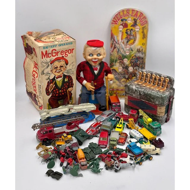 A selection of toys to include a vintage tinplate Rosko Japa...
