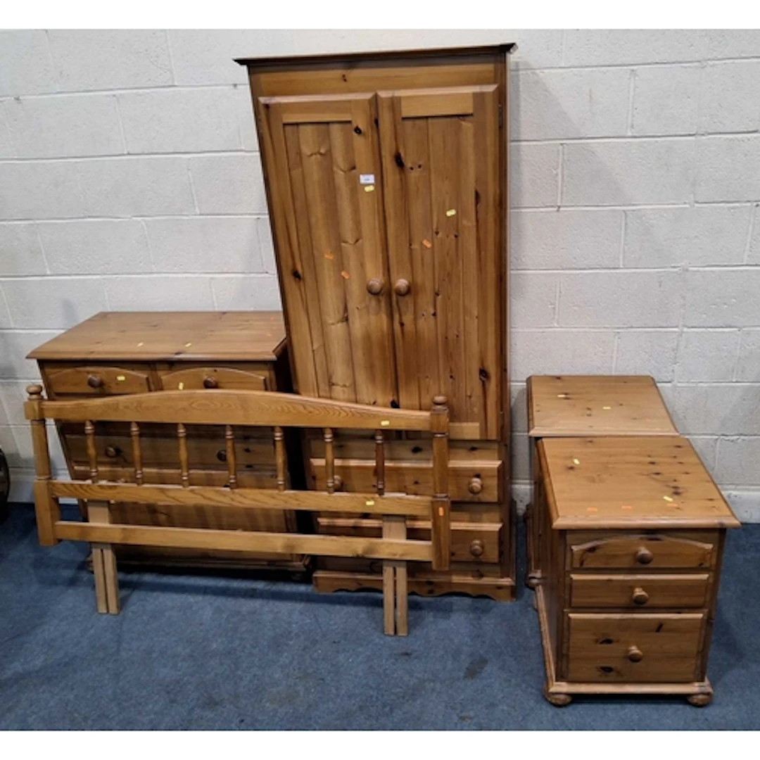 A MODERN PINE DOUBLE DOOR WARDROBE, with two drawers, a ches...