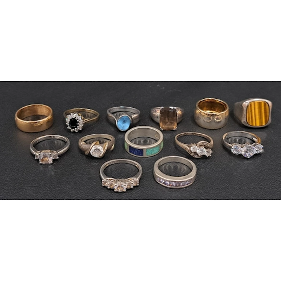 TWELVE SILVER RINGS including examples set with CZ, blue top...