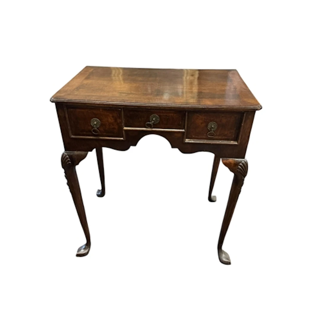 A Queen Anne style walnut lowboy, with two deep flanking one...