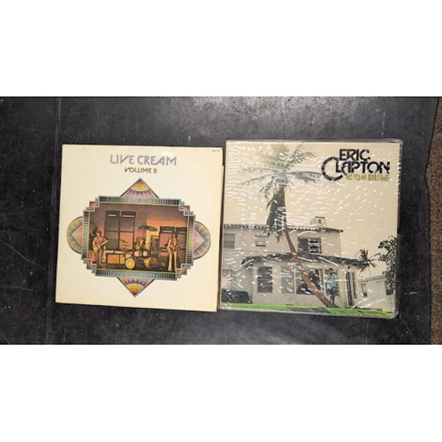 A pair of rock LPs: Cream, Live Cream Volume II, and Eric Cl...