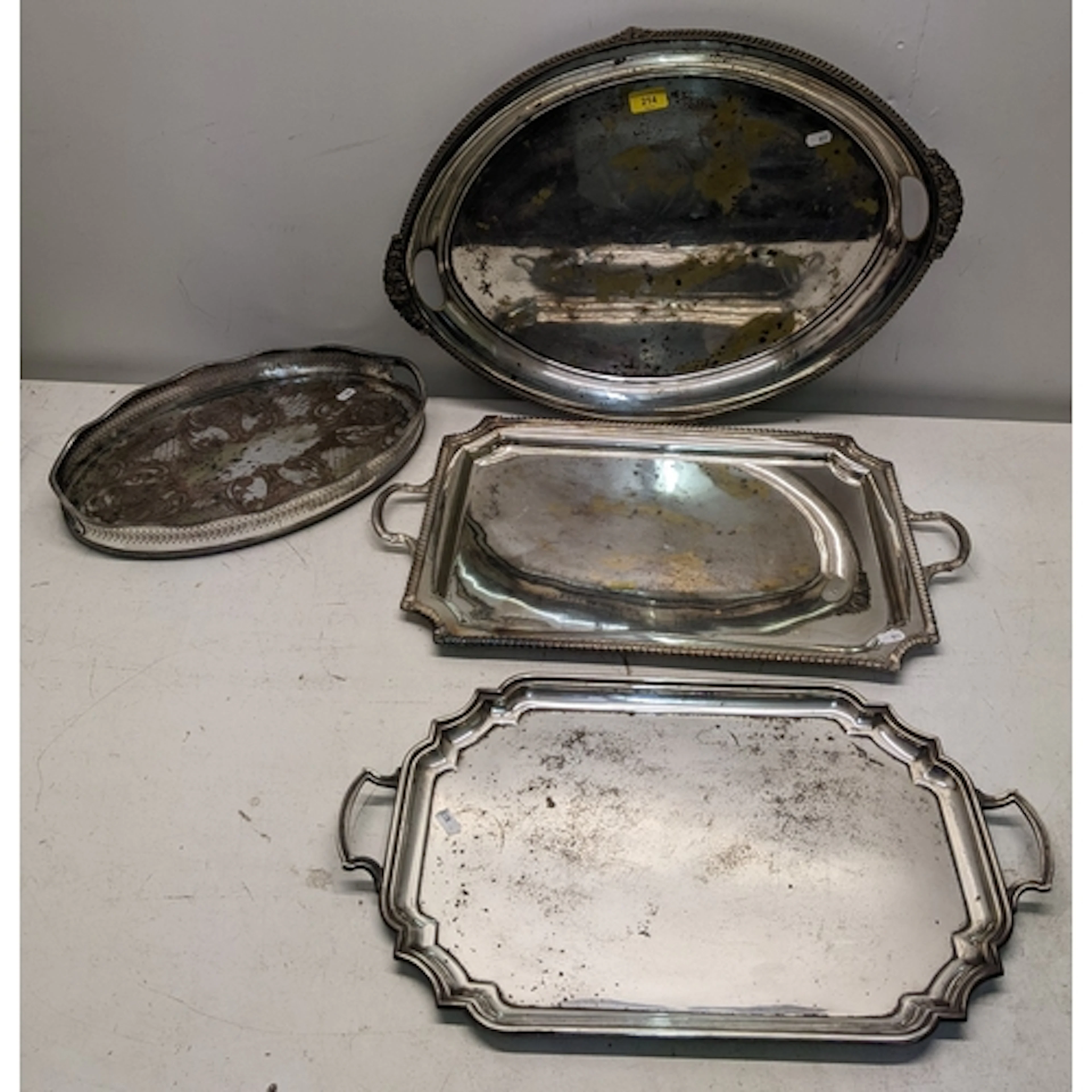 Four silver plated trays to include a Walker & Hall oval tra...