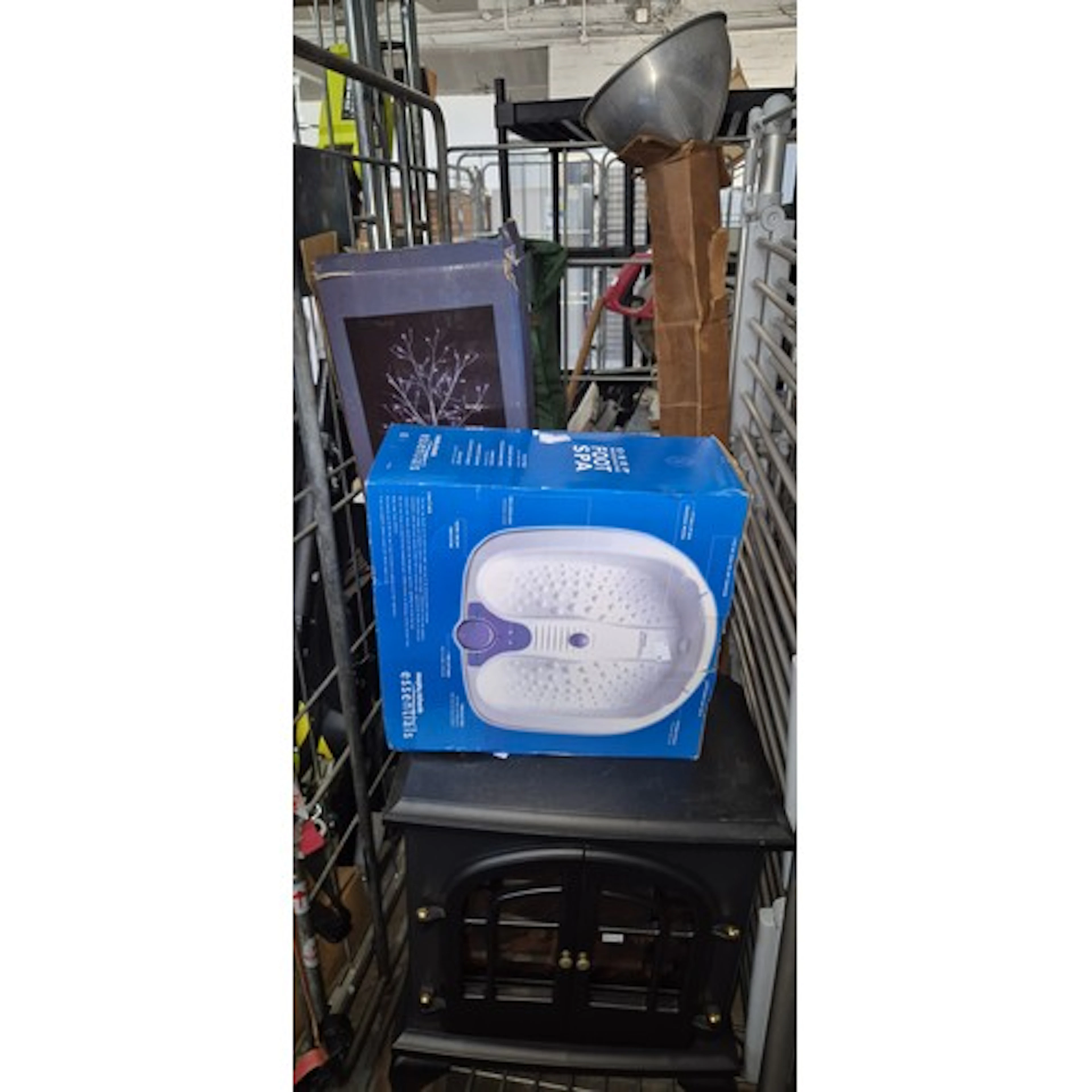 A cage of mixed items including LED birch tree, foot spa, lo...
