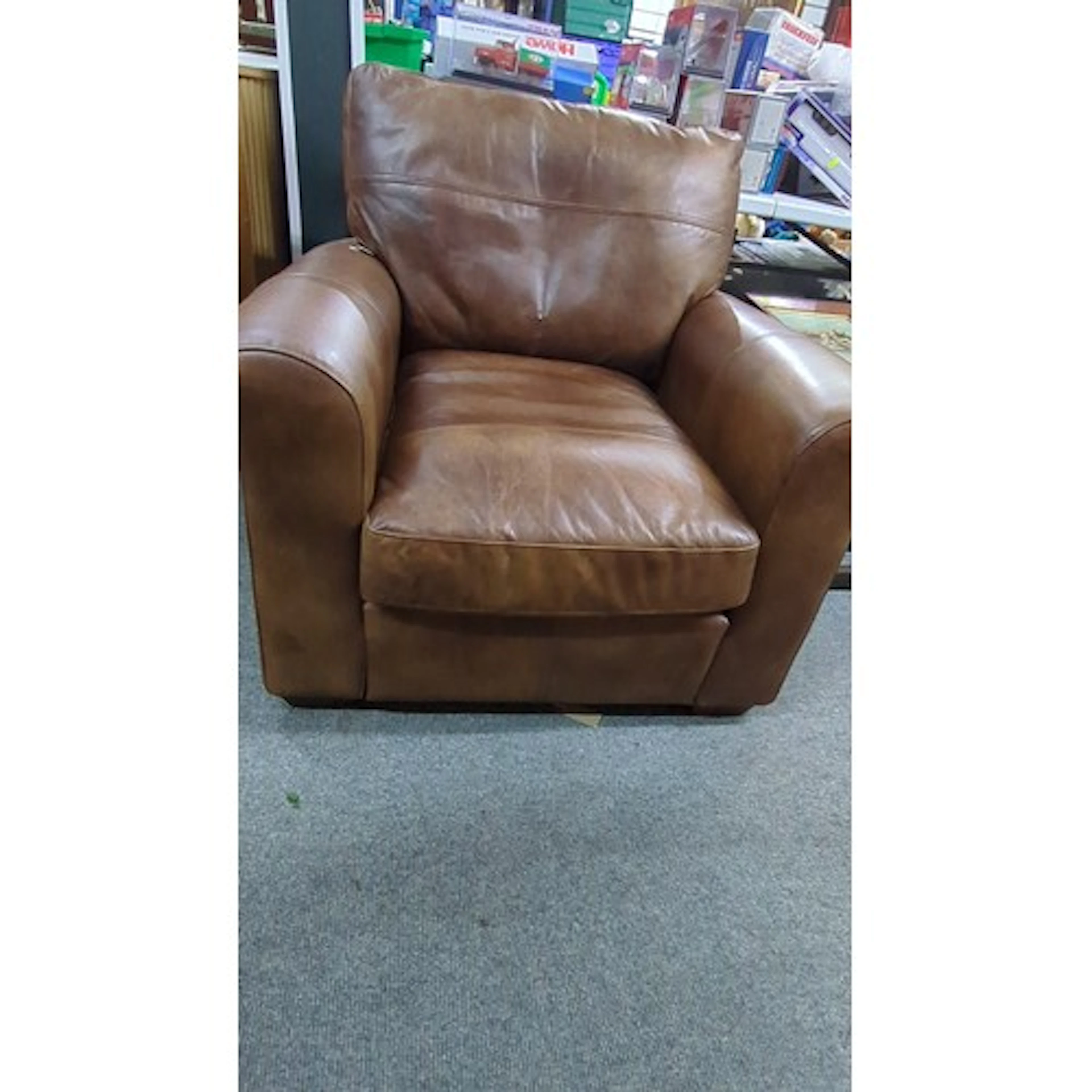 Contemporary tan leather armchair of club form, with padded ...