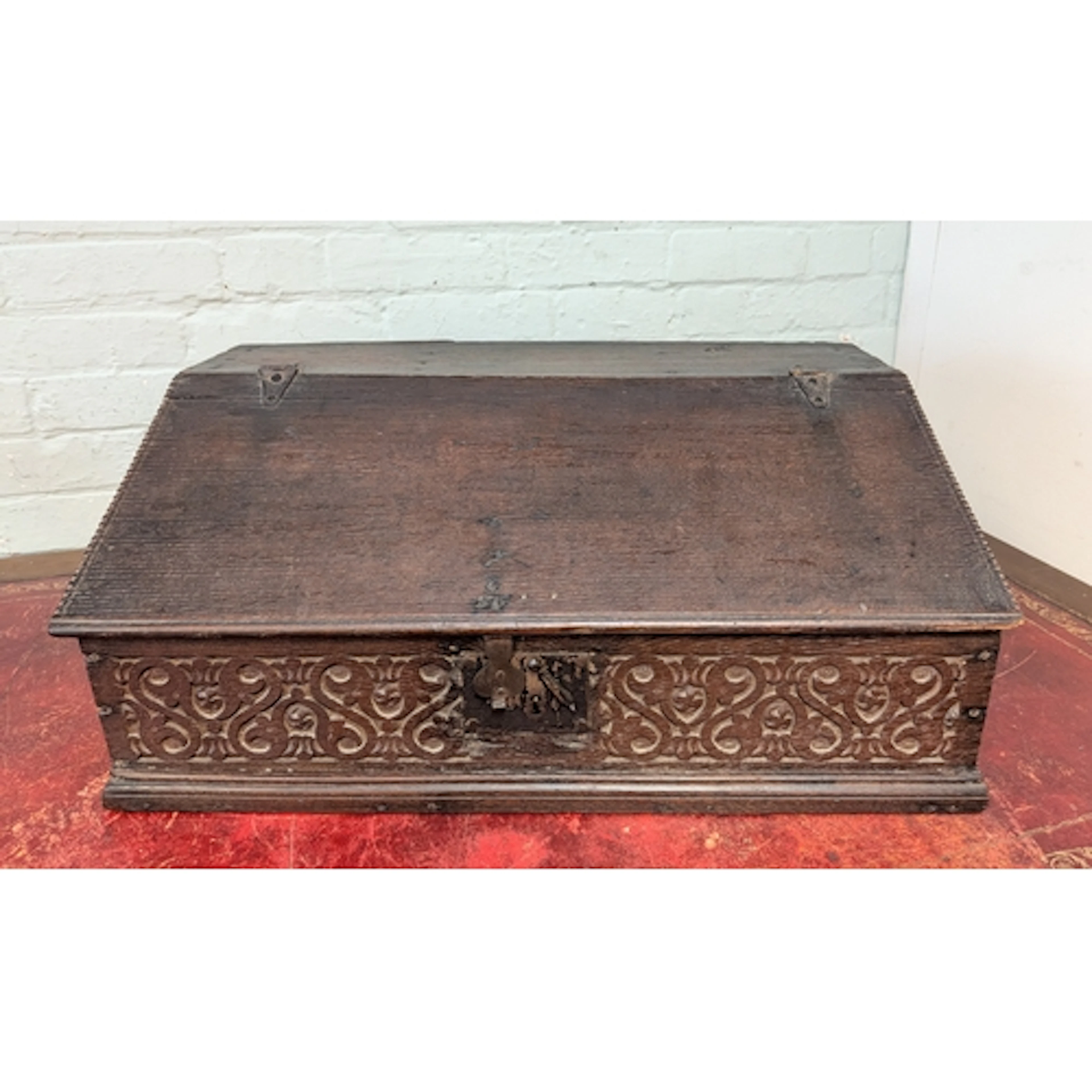 An antique oak lift-top bible box